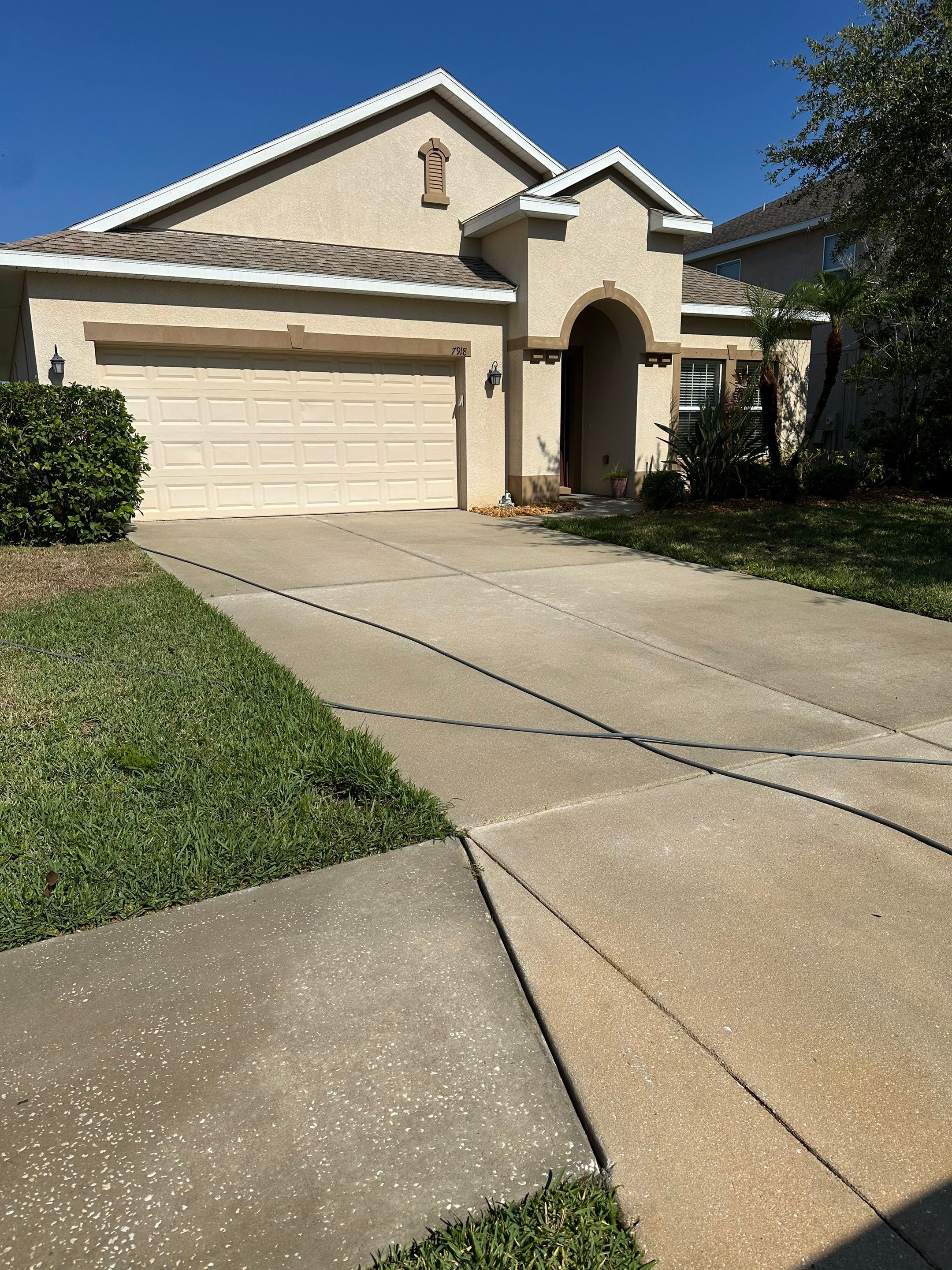 Asphalt Shingle Roof Soft Wash Cleaning & Concrete Pressure Washing in CopperStone Community, Parrish, FL by Sunshine AquaWash
