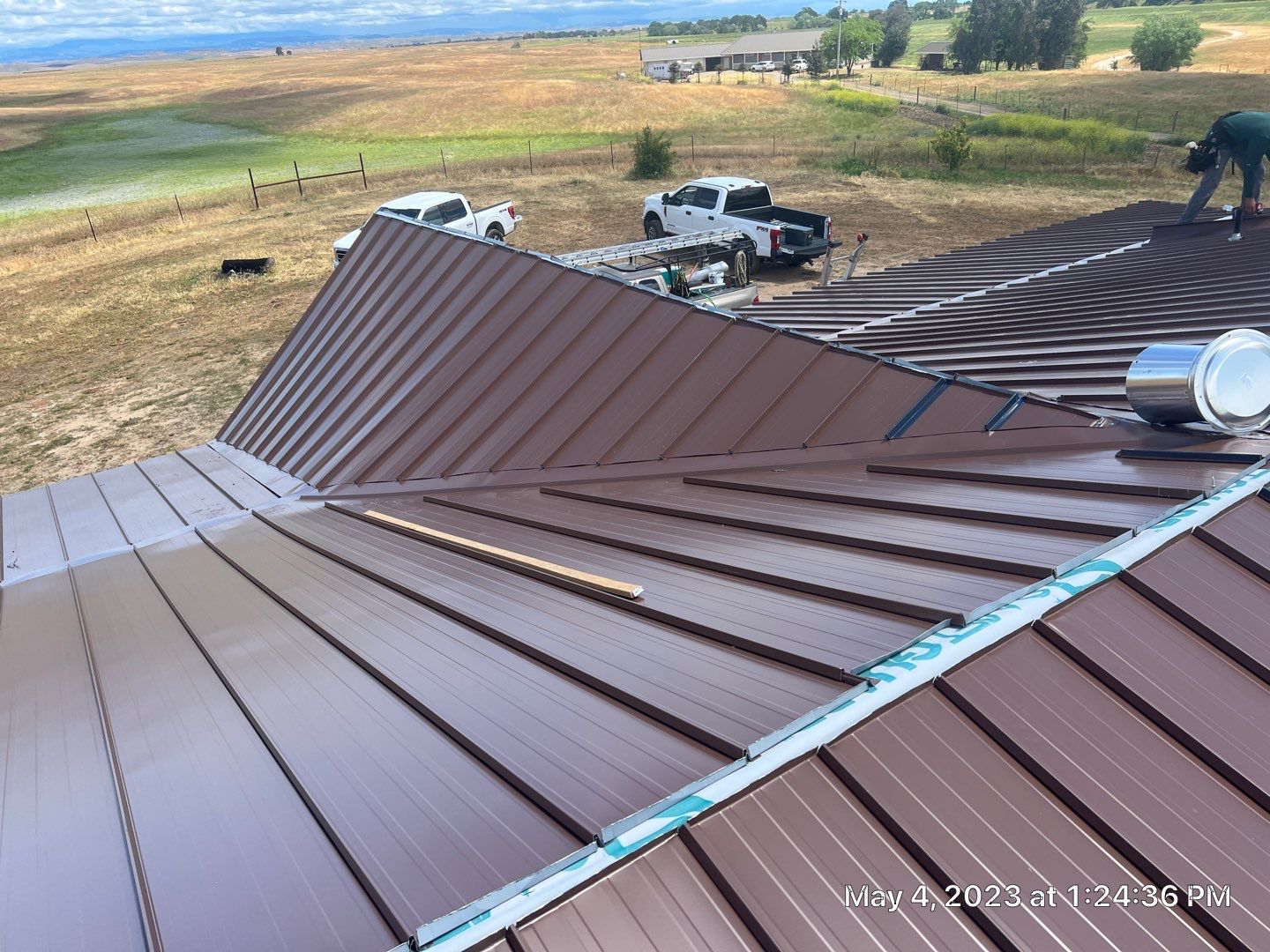 Metal roofing installation using Standing seam metal roofing system by Straight Edge Roofing Inc
