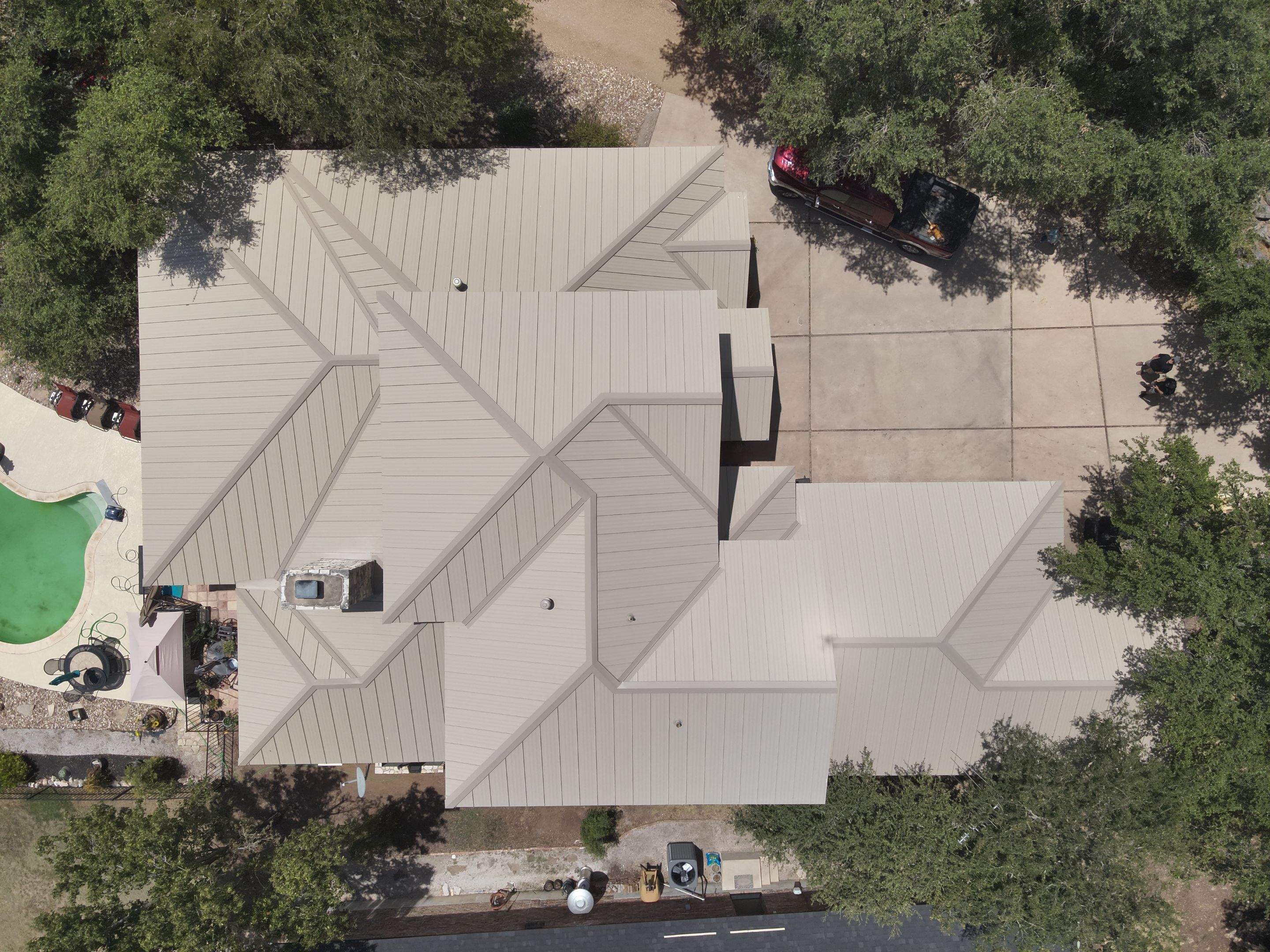 Residential Roof Replacement using 24 GA Double-Lock - Surrey Beige by Action Exteriors Austin
