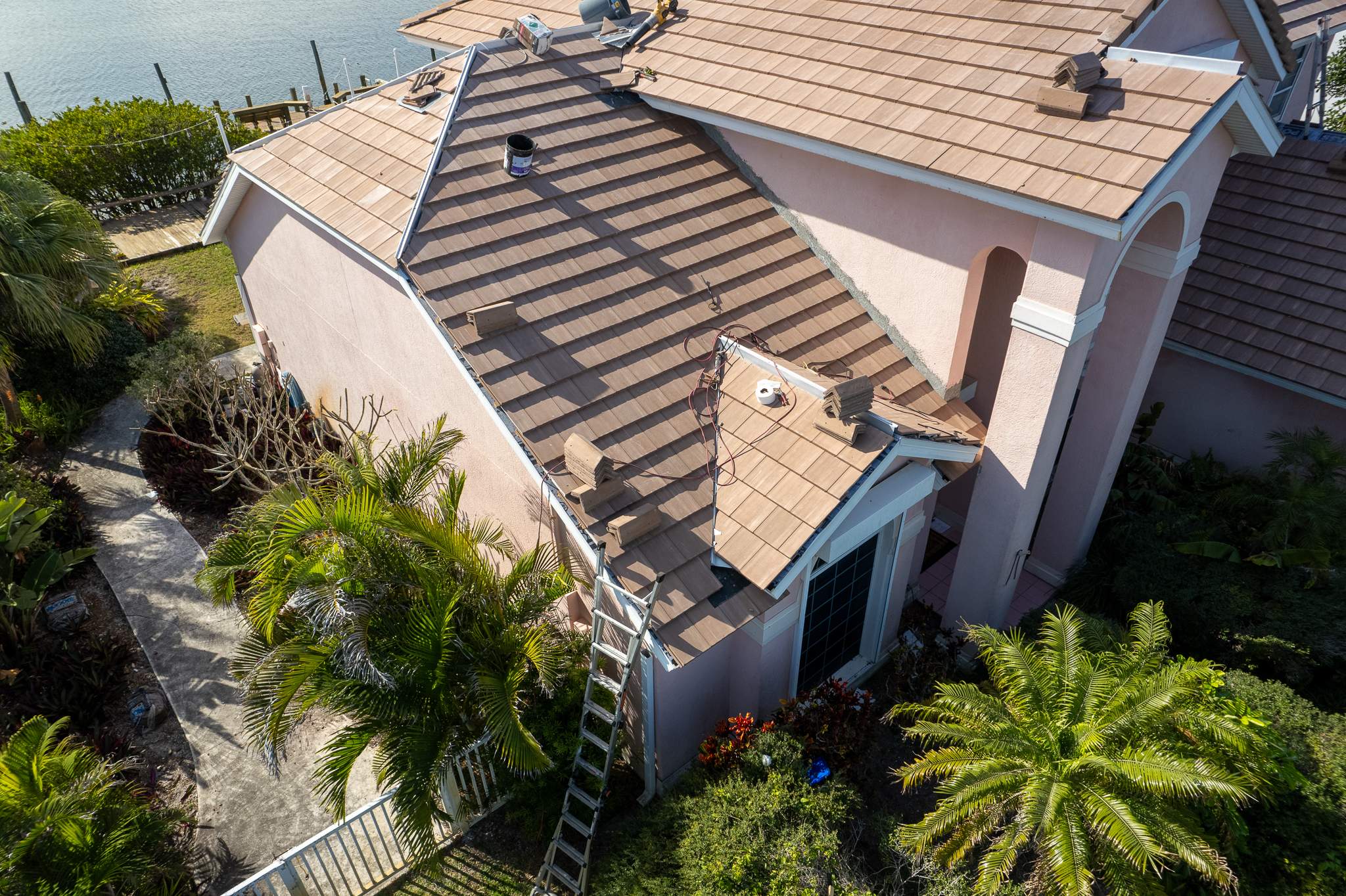 Full Clay Tile Roof Replacement and Deck Repair in Cocoa Beach, Florida by Wiedmann Construction & Roofing