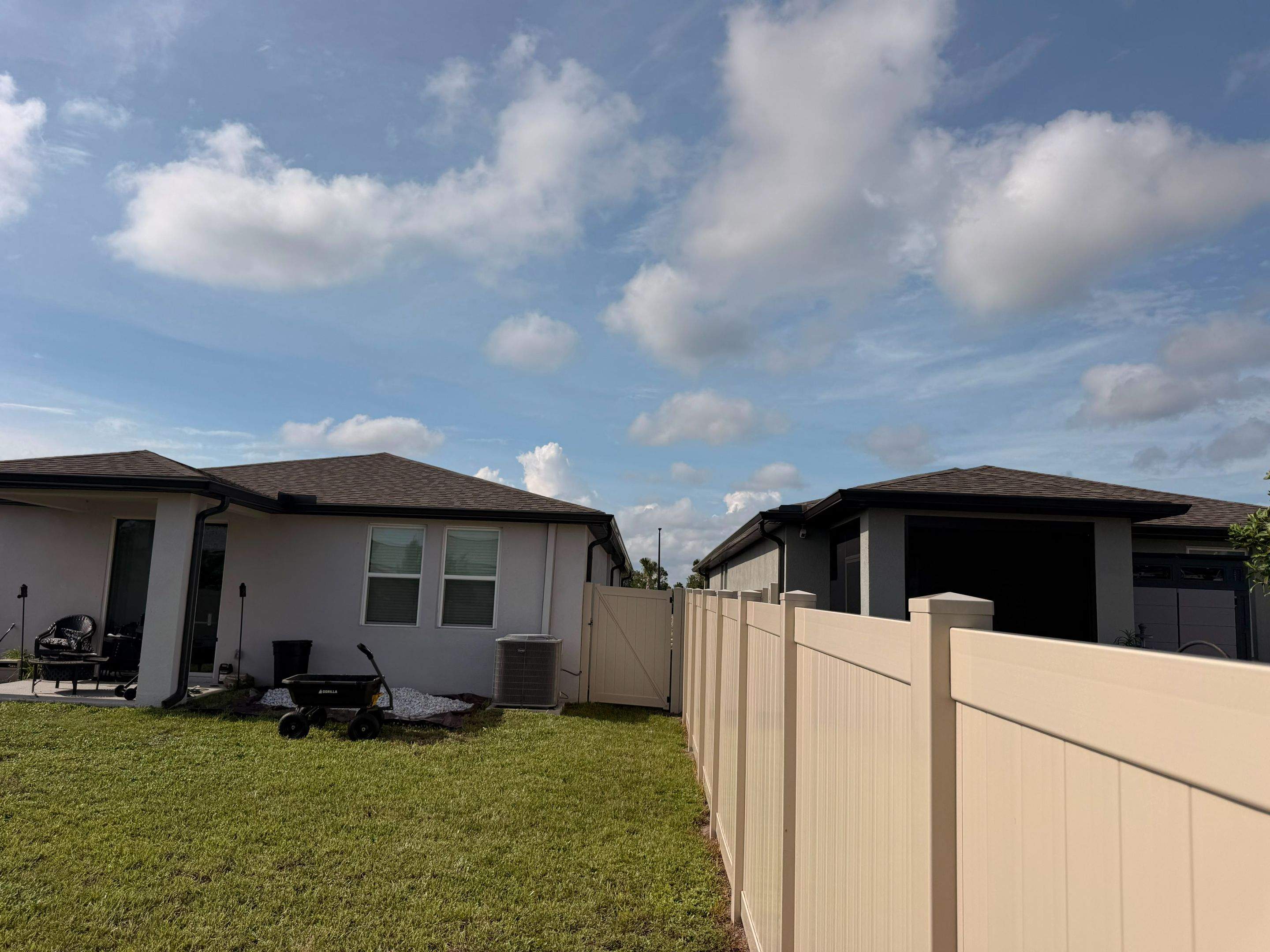 Residential Tan Vinyl Privacy Fence Installation in Nokomis by True Fence LLC