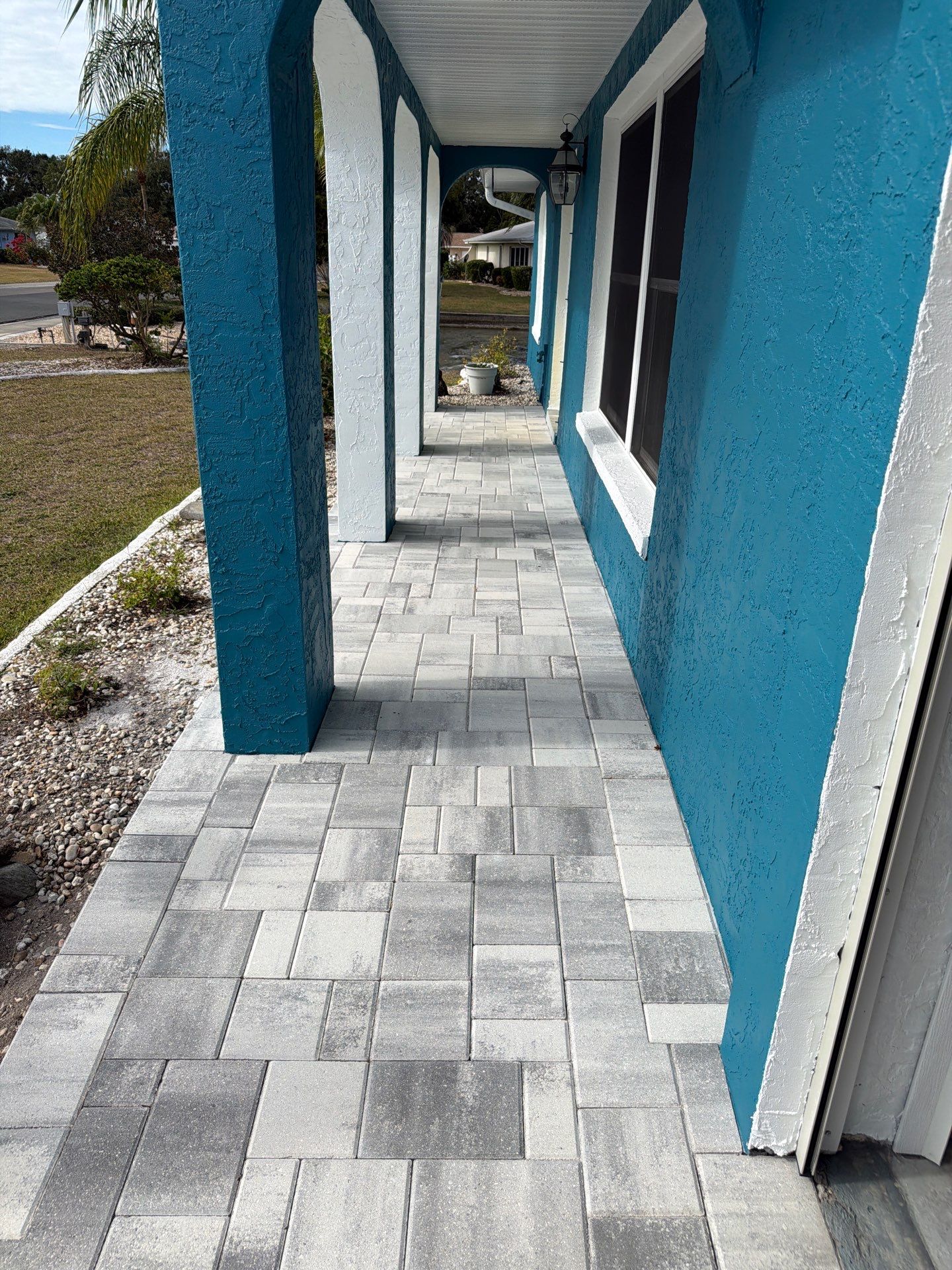 Modern Gray Paver Driveway and Entryway Walkway in Sun City Center by Supreme Paver Experts