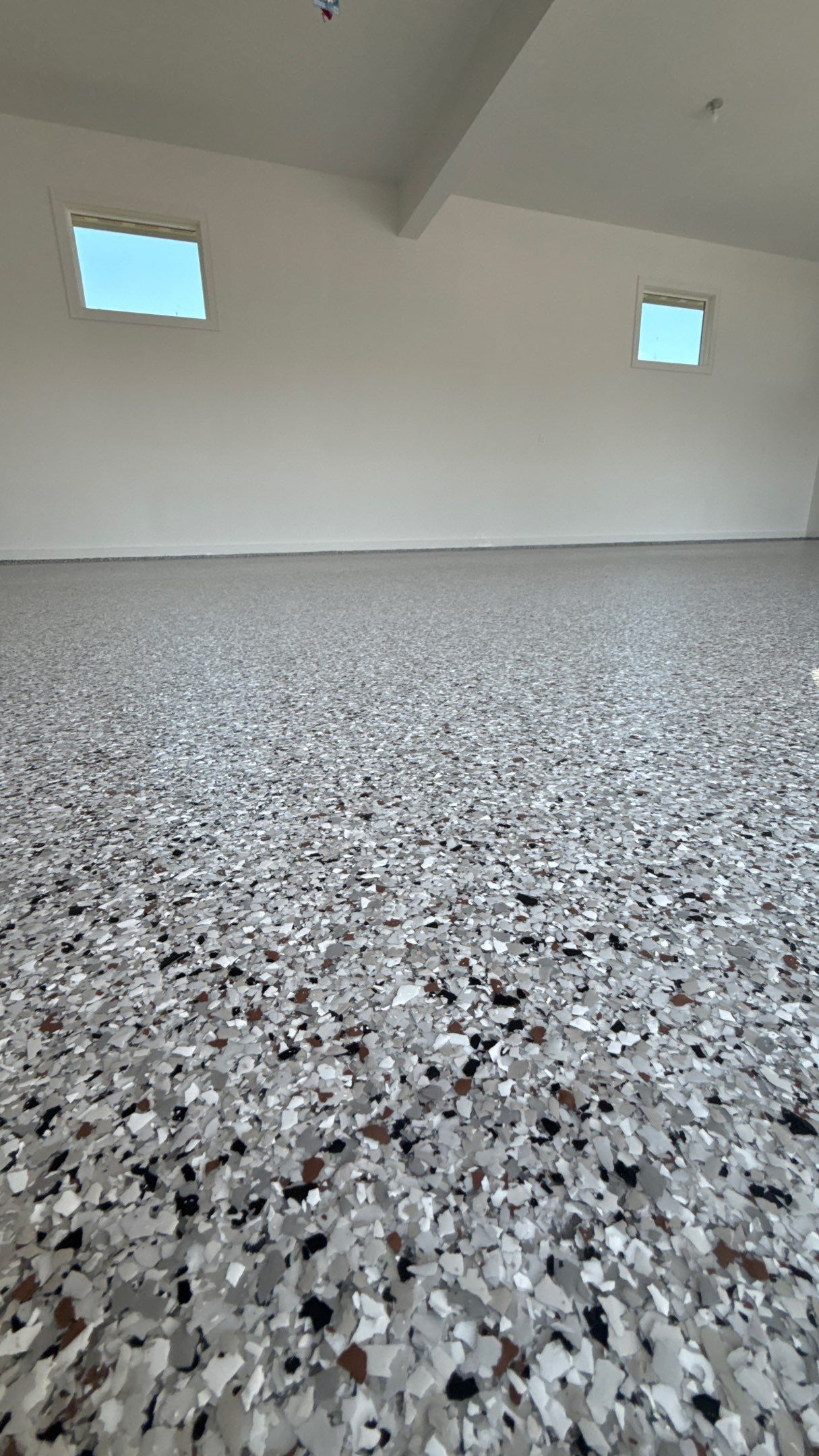 Custom Garage Epoxy Flake Floor Coating in Leawood by Banner Garage