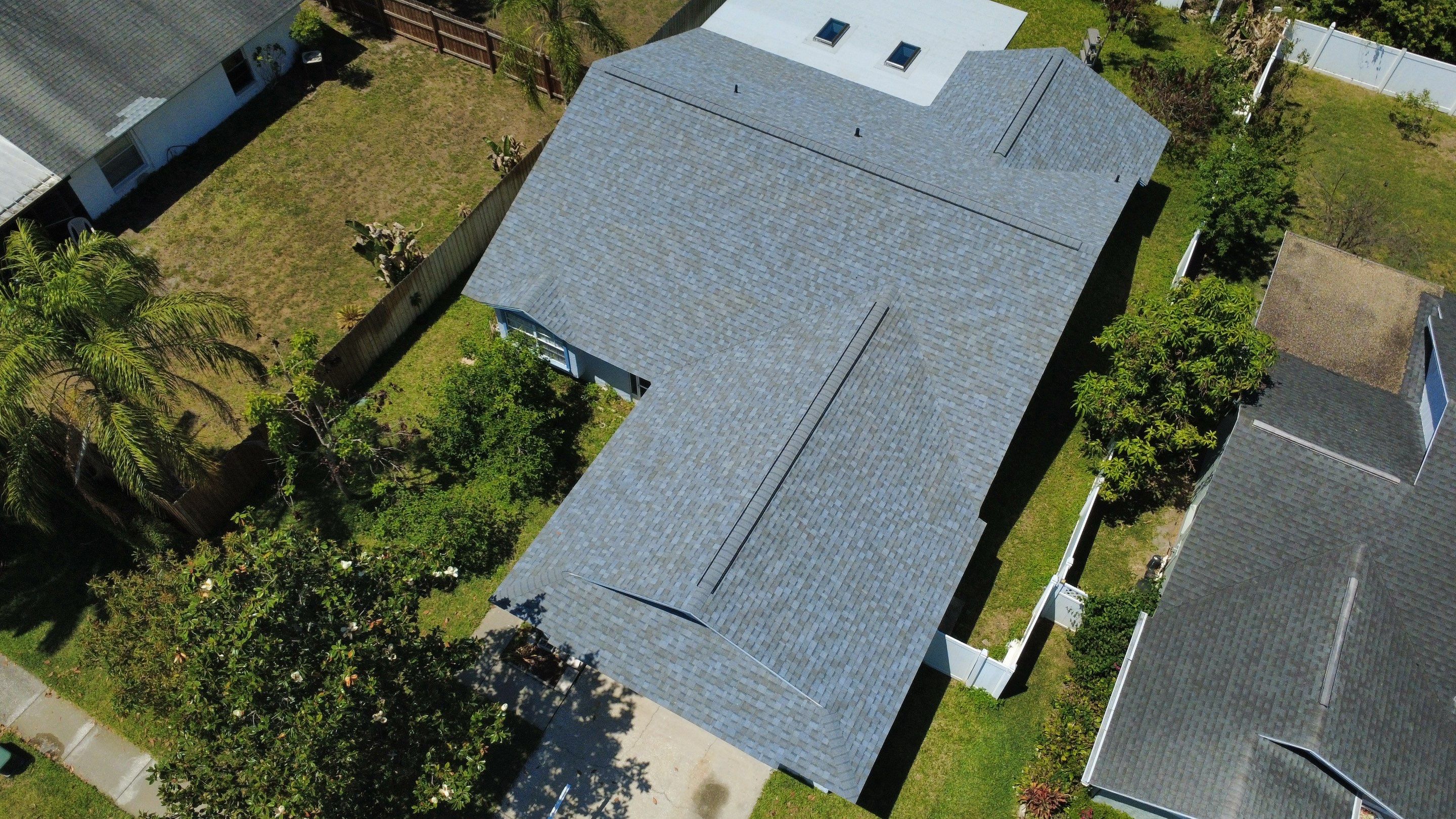 Owens Corning Shingle Roof Replacement and Skylight Upgrade in Tampa by Steadfast Roofing