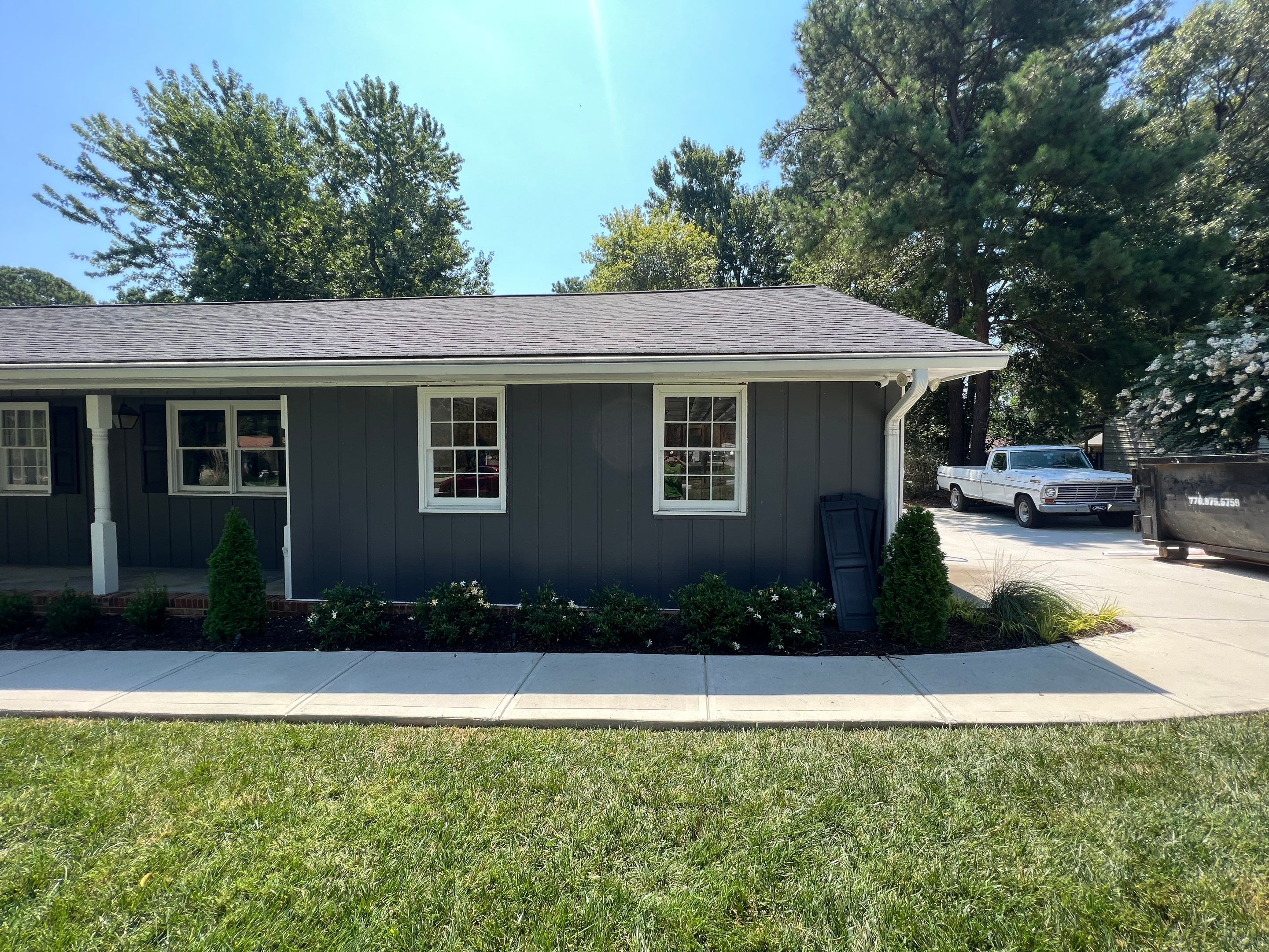 Snellville Garage Remodel Featuring Epoxy Floors and Board and Batten Siding by Swift Home Renovations