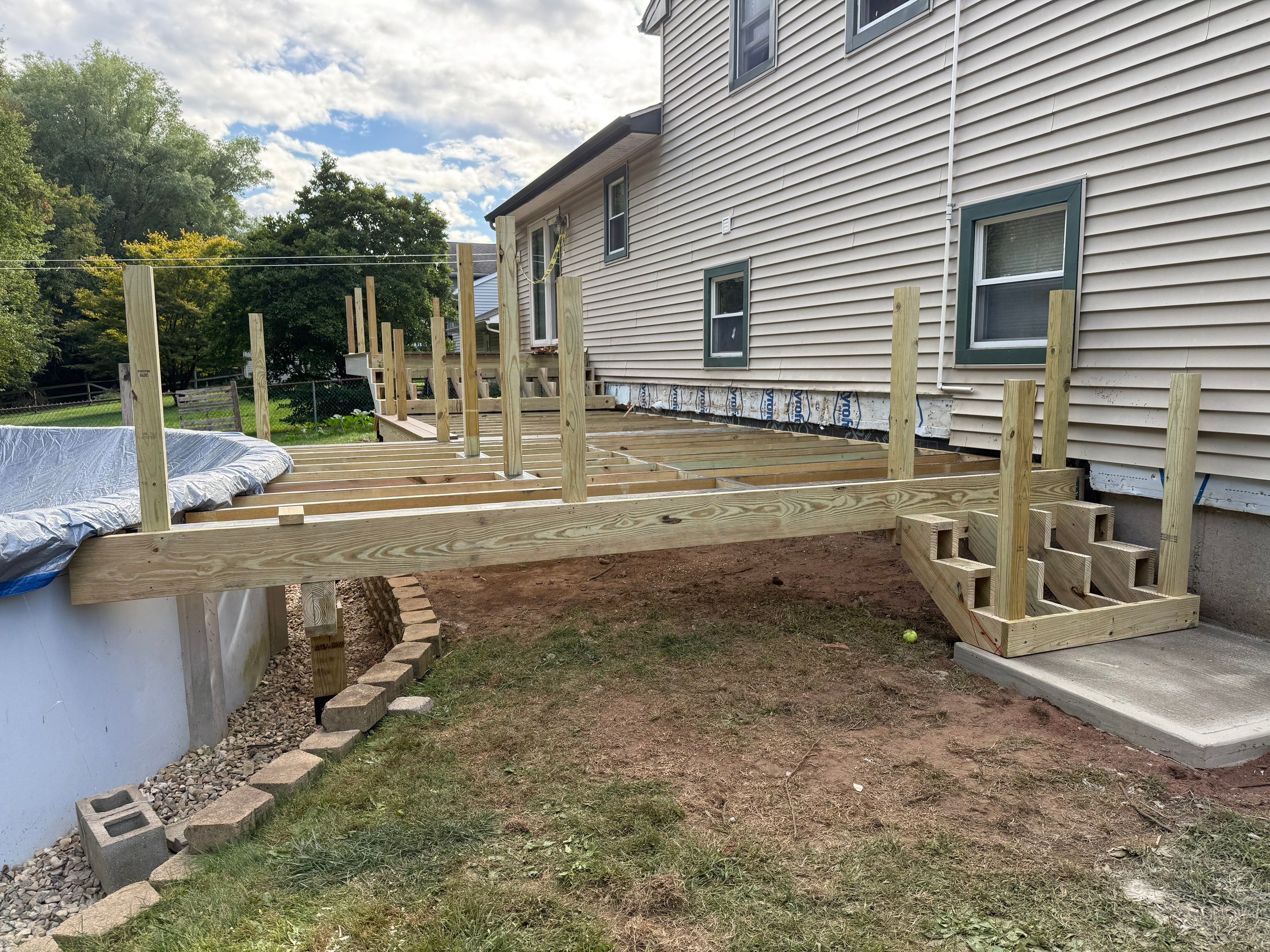 Replacement pool deck with Trex Lineage Carmel and Transcend railings by DiGiorgi Roofing and Siding Inc