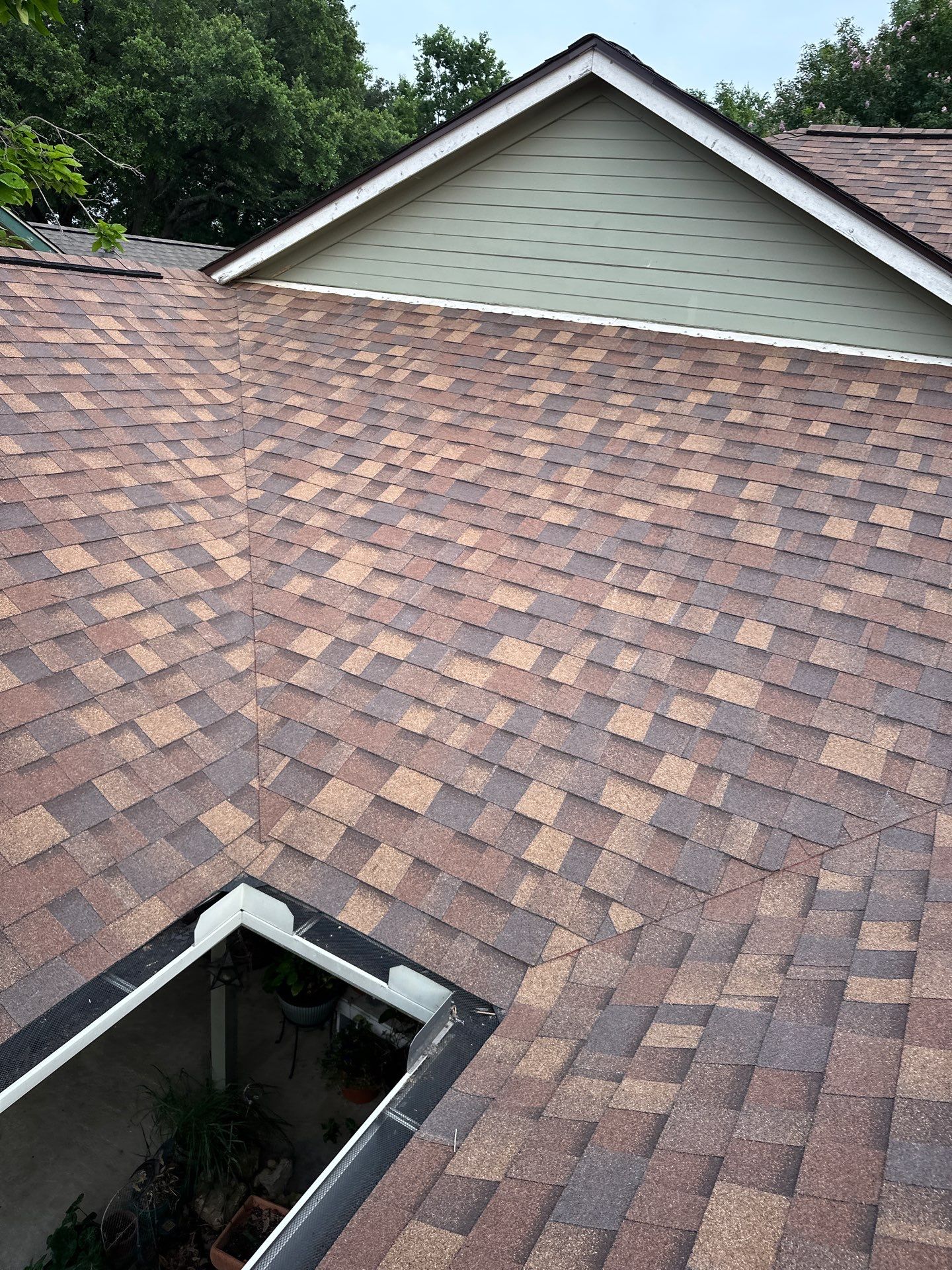 Residential Roofing Installation using Owens Corning TruDef Desert Rose by DeZign Roofing & Exteriors