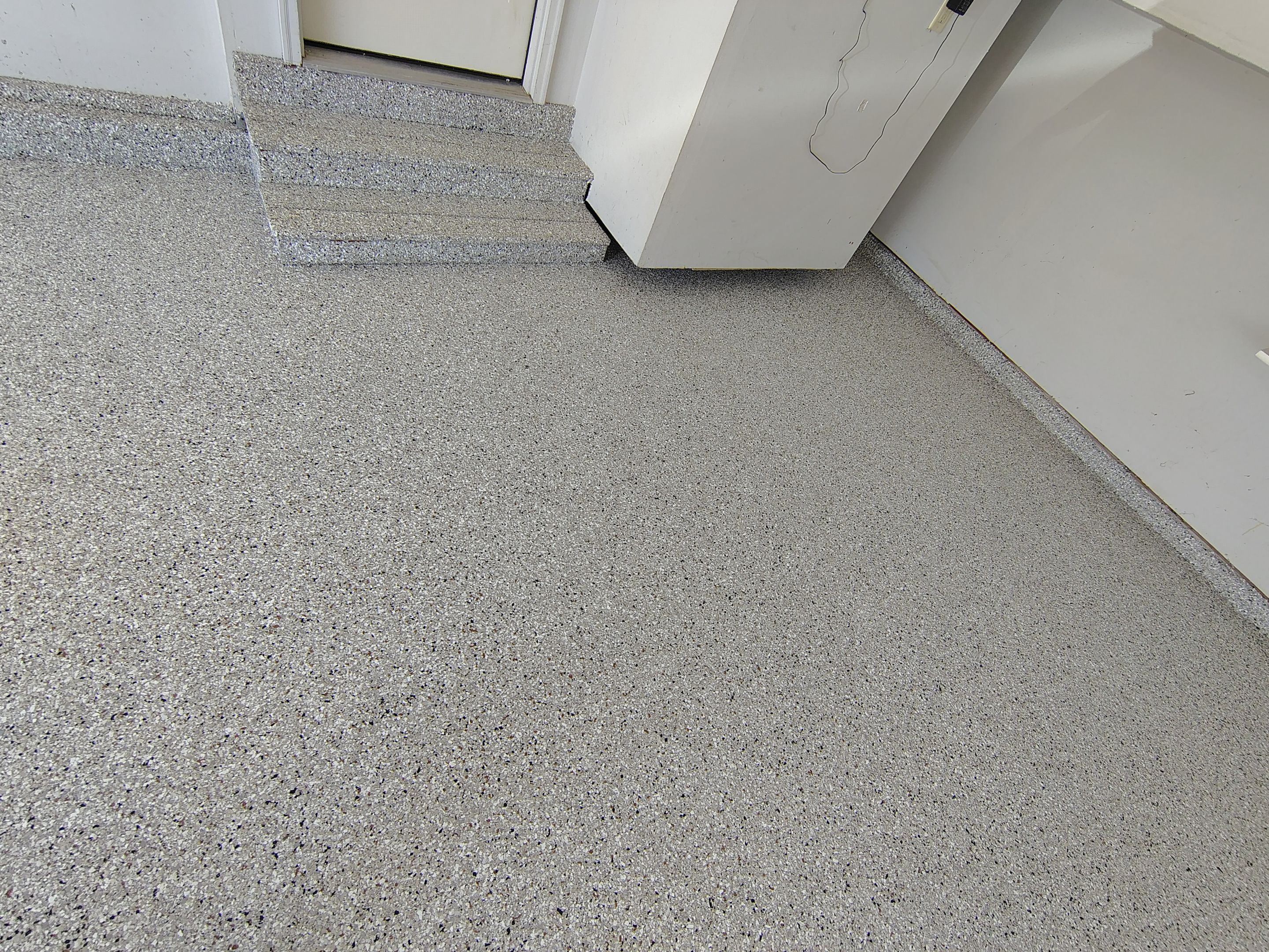 Decorative Chip Epoxy Garage Floor Coating in Sioux Falls by Select Painting, Coatings & Garage Cabinets
