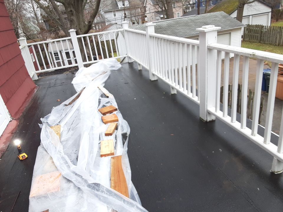 Residential Roof Replacement using Patio Roof by Absolute Roofing and Construction
