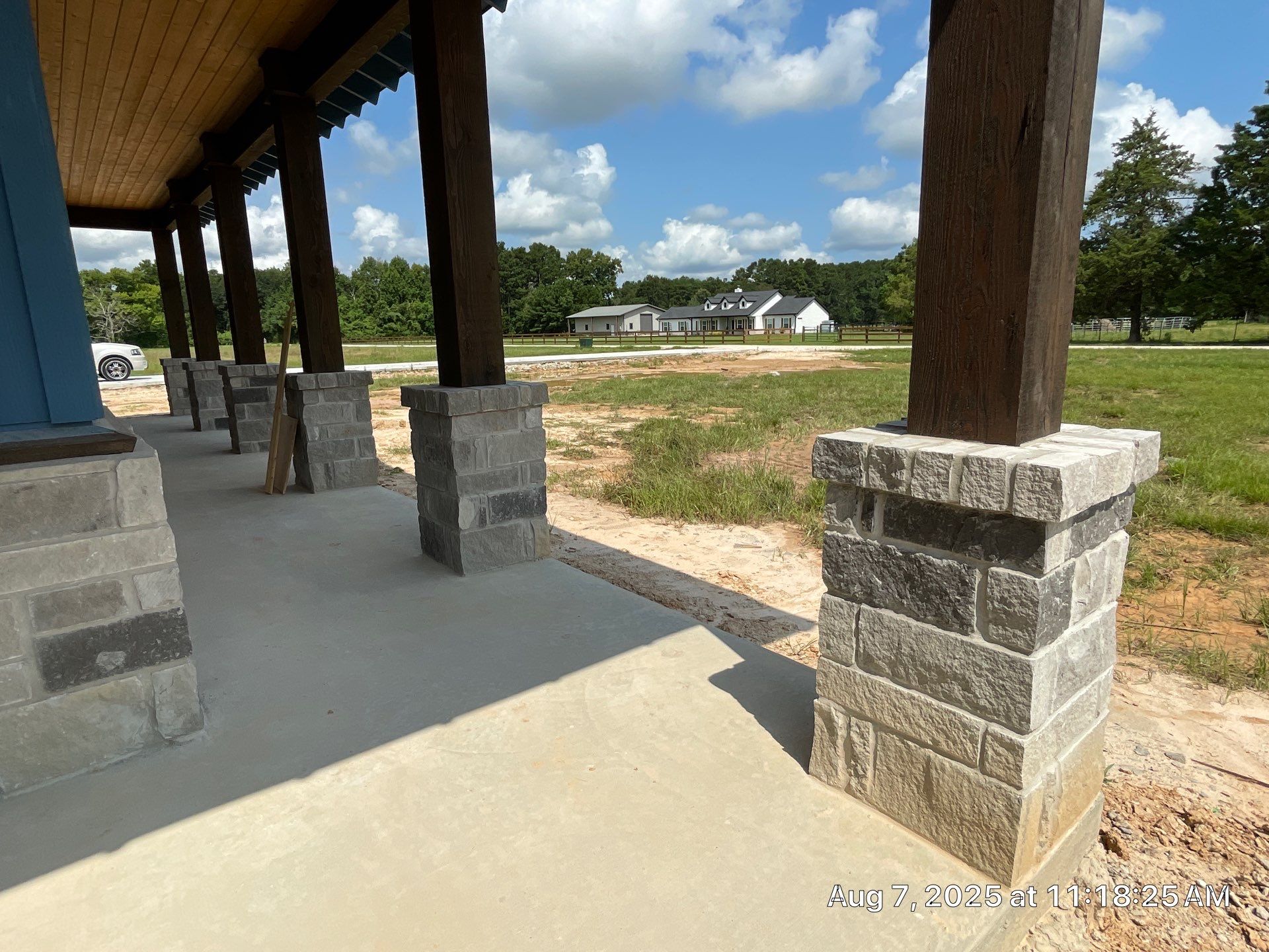 Natural Stone Elegance: Apex Installation Accented by Blue Siding by Apex Conventional Stucco Llc