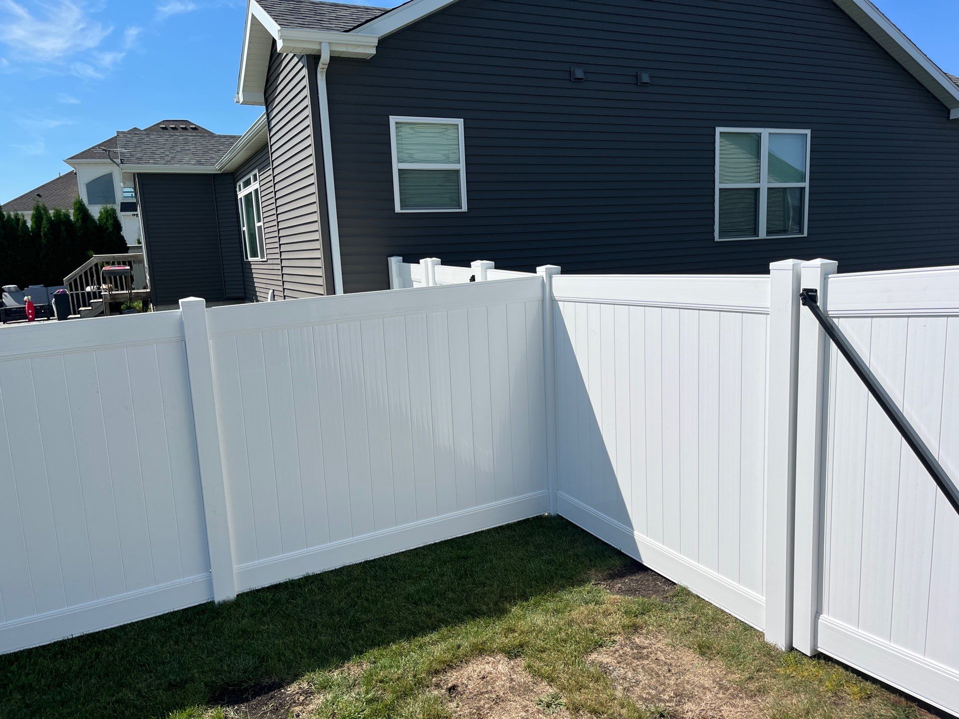 New Vinyl Privacy Fencing and Gates for Waterloo Residential Backyard by Perfect Picket Fence and Stain