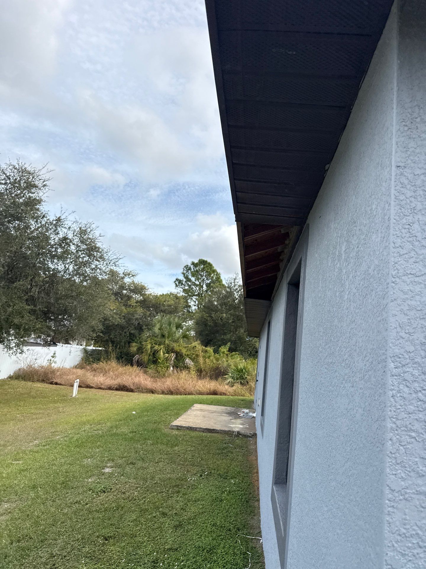 Black Seamless Gutters & Soffit/Fascia in Lehigh Acres FL by Gutter Professors