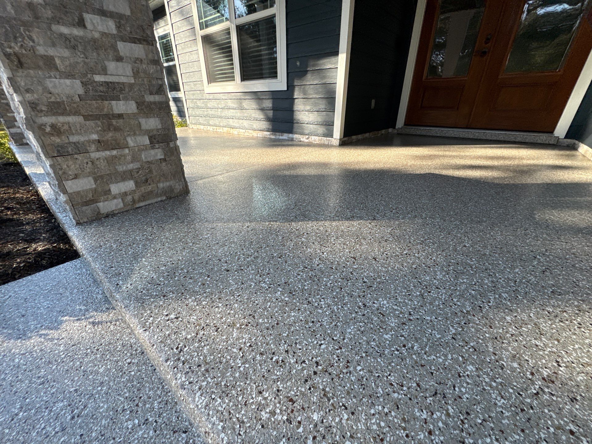 Front and Back Porches in Chiefland, FL in Pebble Beach by Cross Creek Concrete Coatings