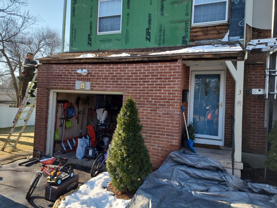 James Hardie siding, new metal roof and couple windows being installed. by UBrothers Construction