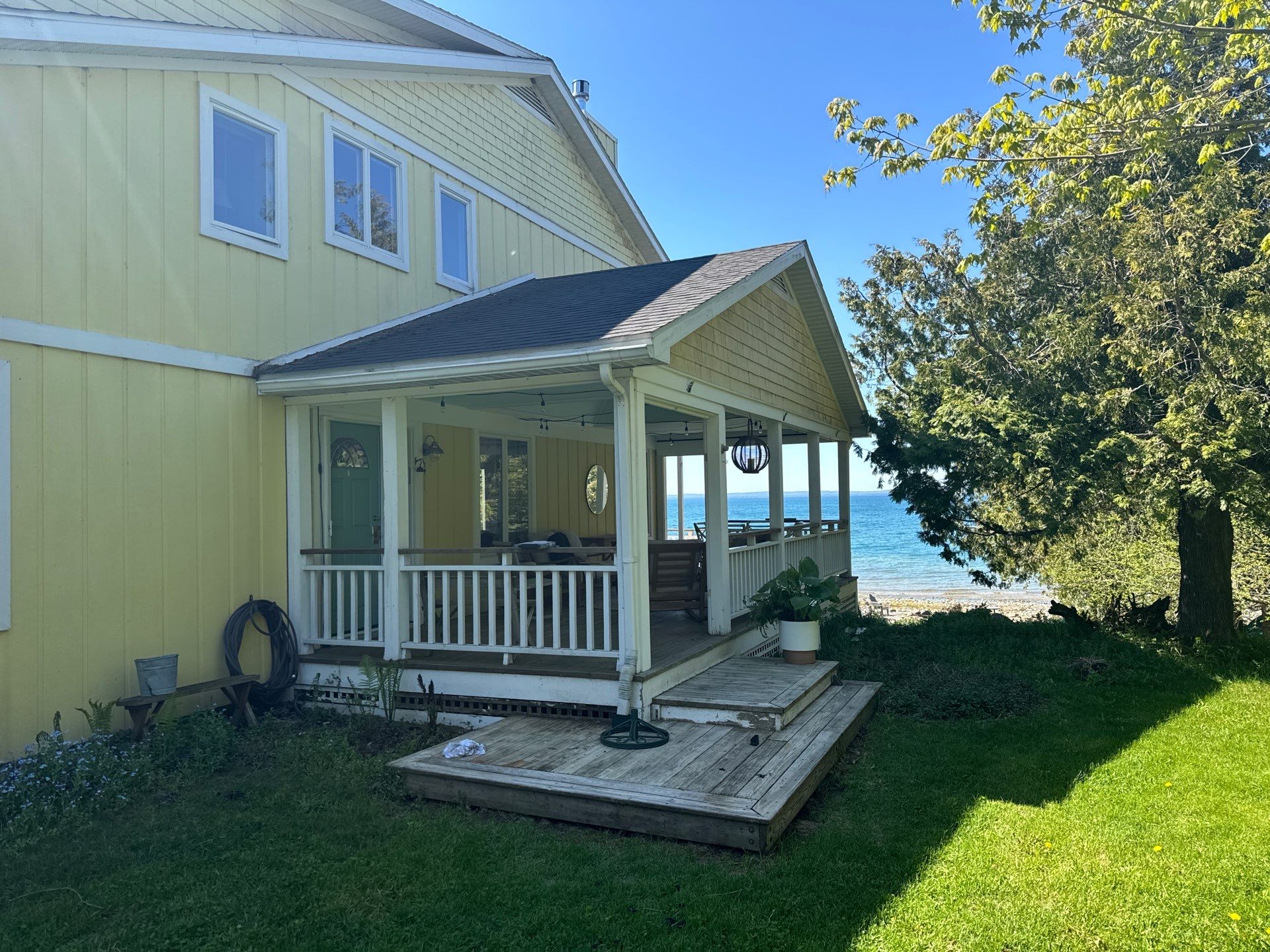 Sunesta motorized Sentry Privacy Screen Installation for Saint Ignace Waterfront Porch by Rainbow Seamless Systems