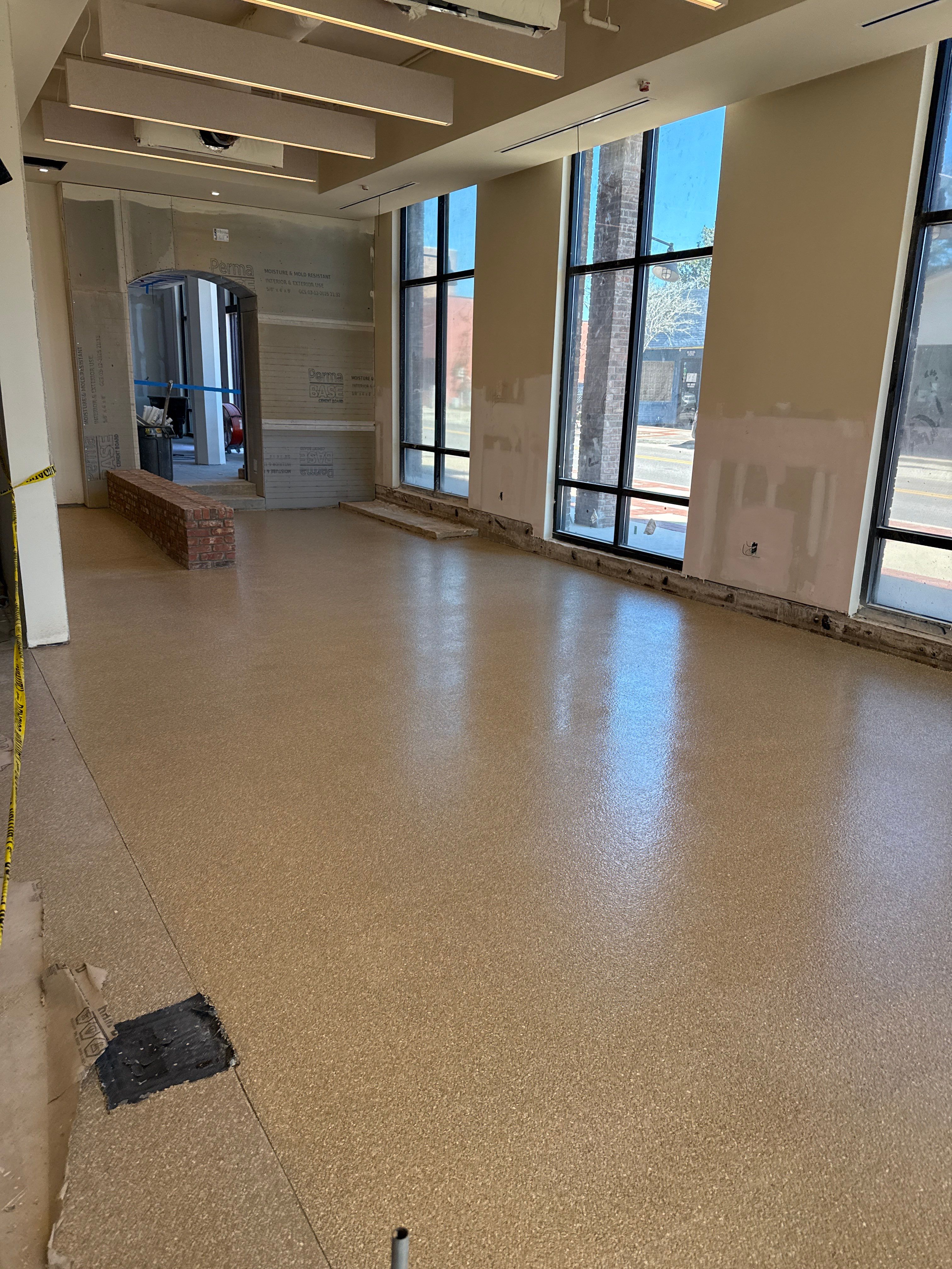 Industrial Epoxy Flake and Concrete Overlay Floor Installation in Pensacola by Cornerstone Hard Surface Restoration