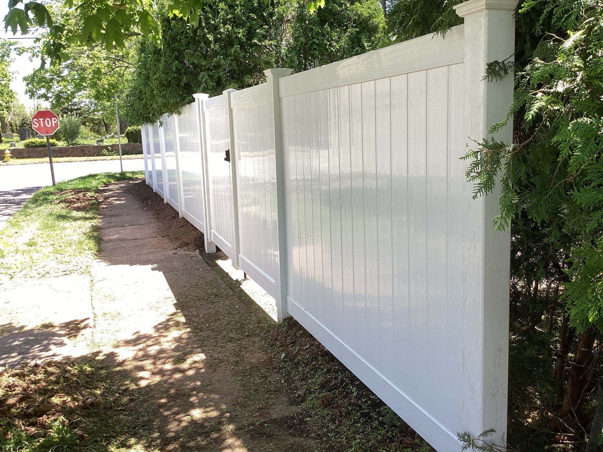Fence replacement with White Vinyl privacy fence and matching gates  by DiGiorgi Roofing and Siding Inc