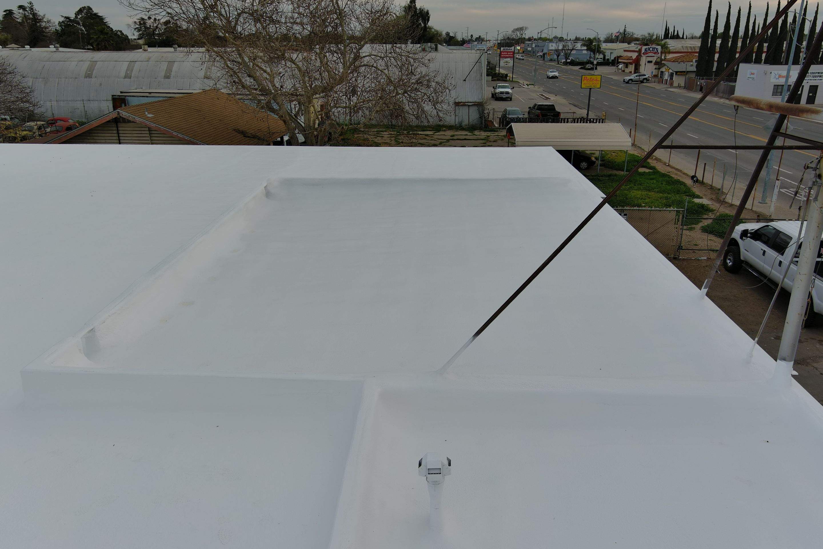 Spray foam and coatings using Conklin Benchmark/PUMA XL coatings and spray foam by Straight Edge Roofing Inc