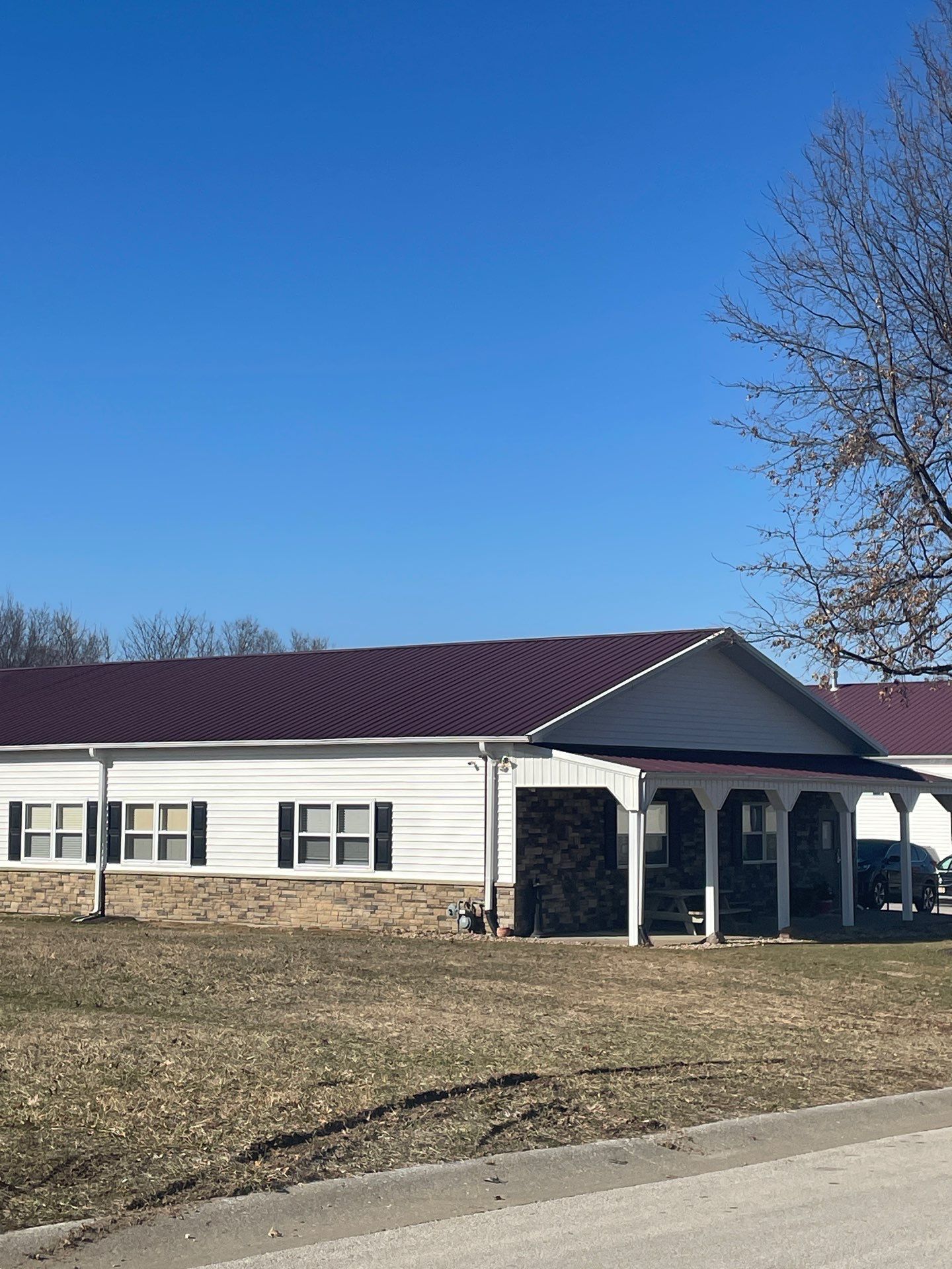 Siding and Stone Installation using Extrerior Porfolio Vinyl Siding and Versetta Stone by EEC  Windows, Siding & Roofing 