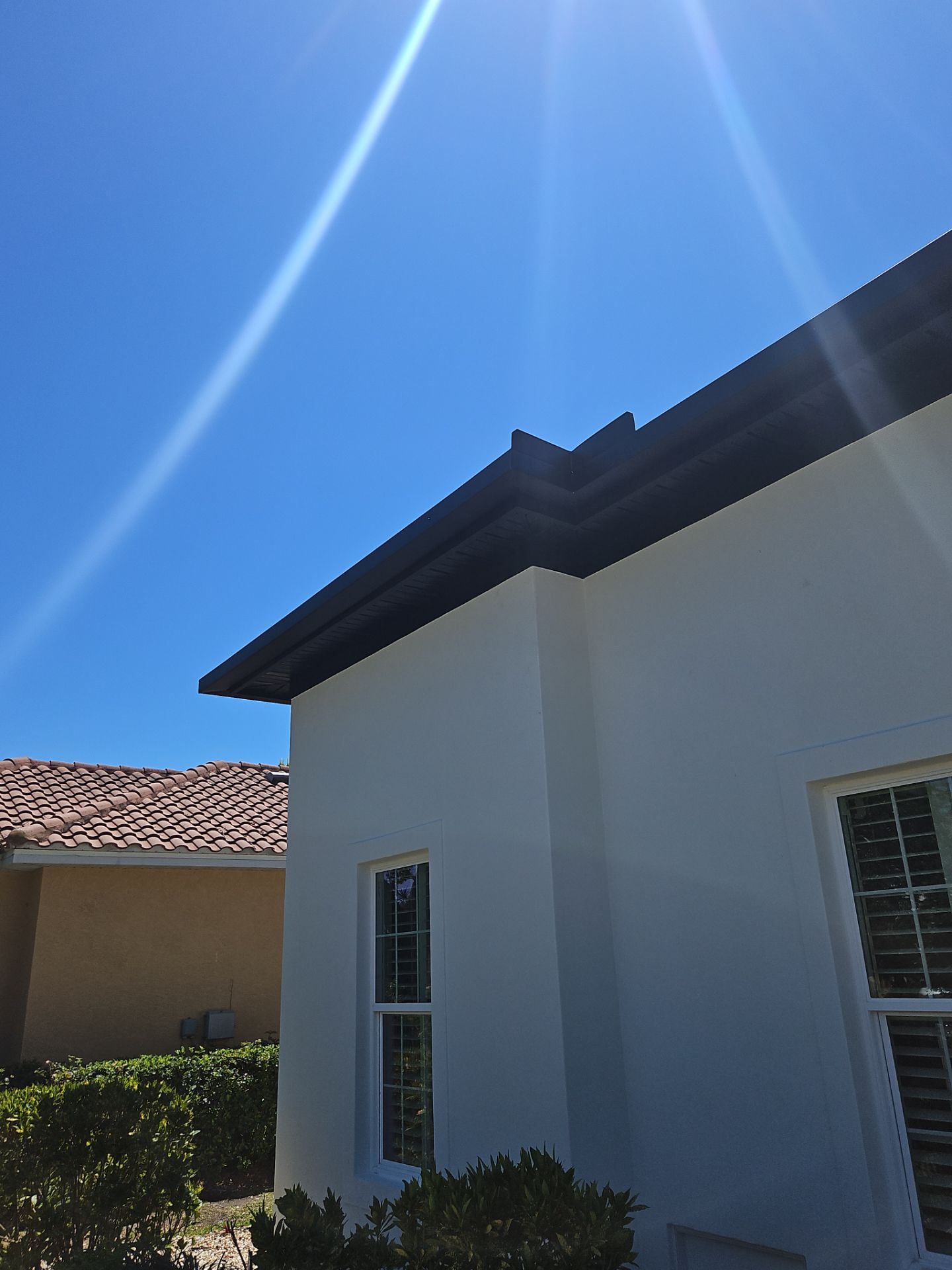 Soffit and Fascia Installation and black seamless gutters in Sarasota FL by Gutter Professors