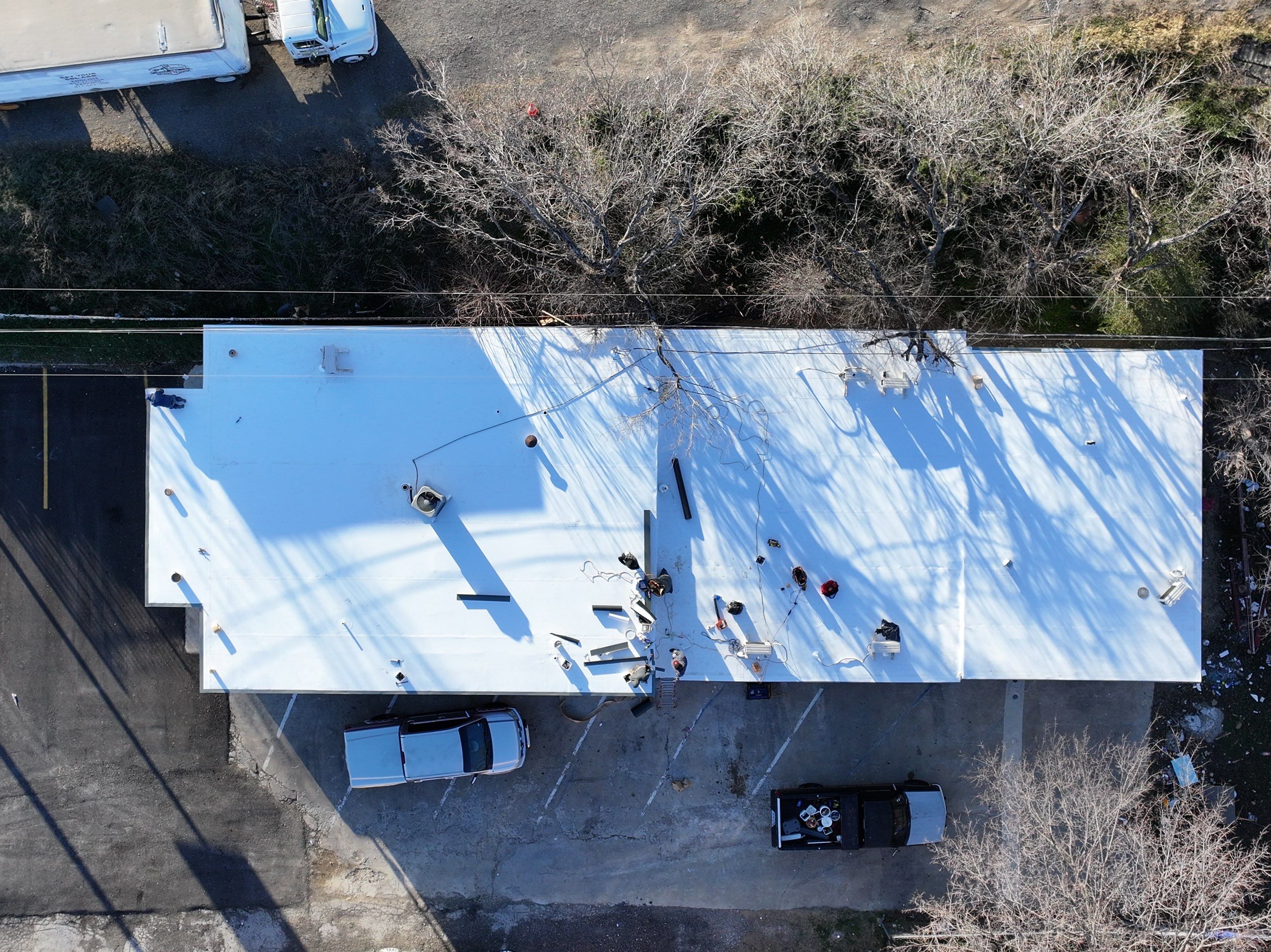 Commercial roofing overlay using GAF TPO over an old ballast roof by Becker Roofing and Exteriors