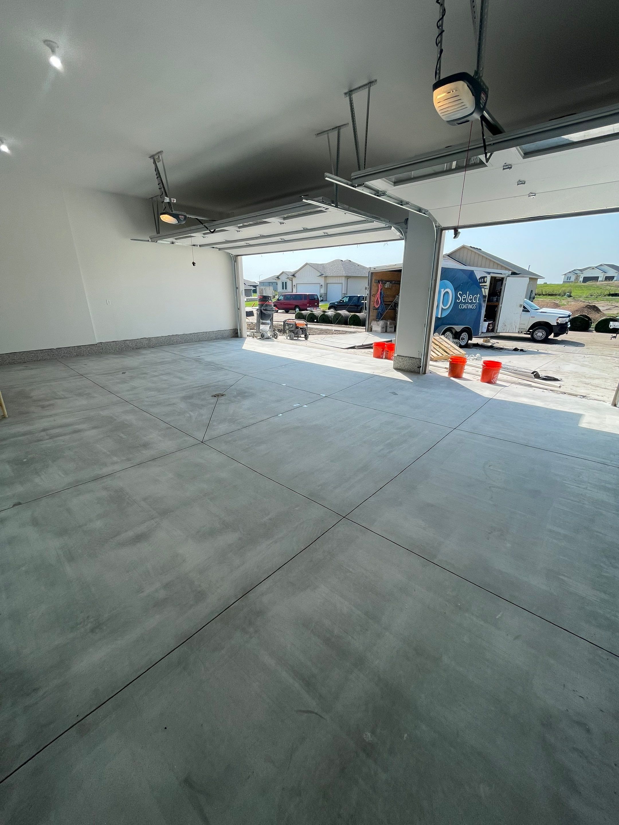Grey Speckled Garage Floor Coating in Sioux Falls by Select Painting, Coatings & Garage Cabinets
