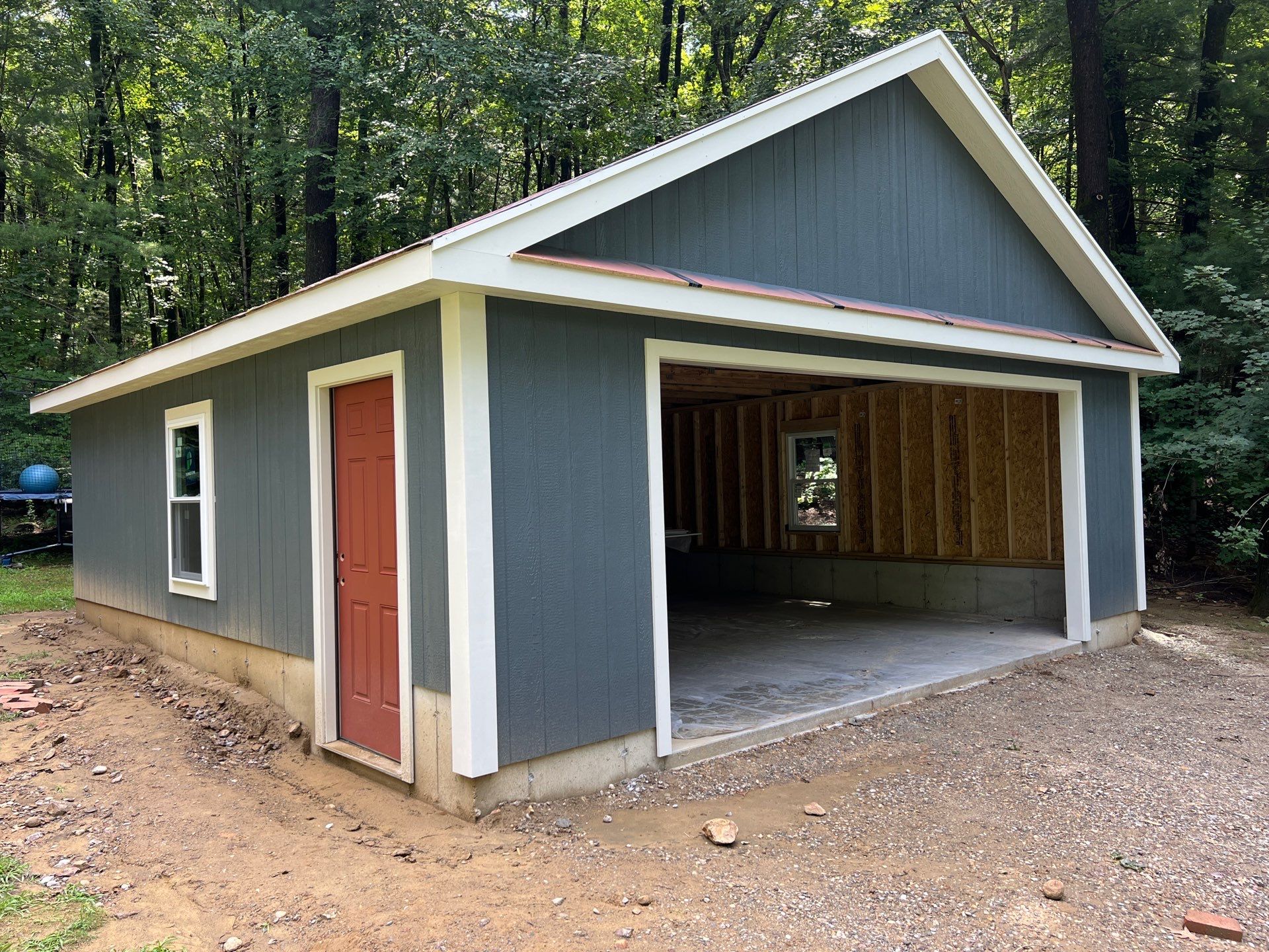 Garage using LP SmartSide Panel Siding by Chagnon Building & Remodeling LLC