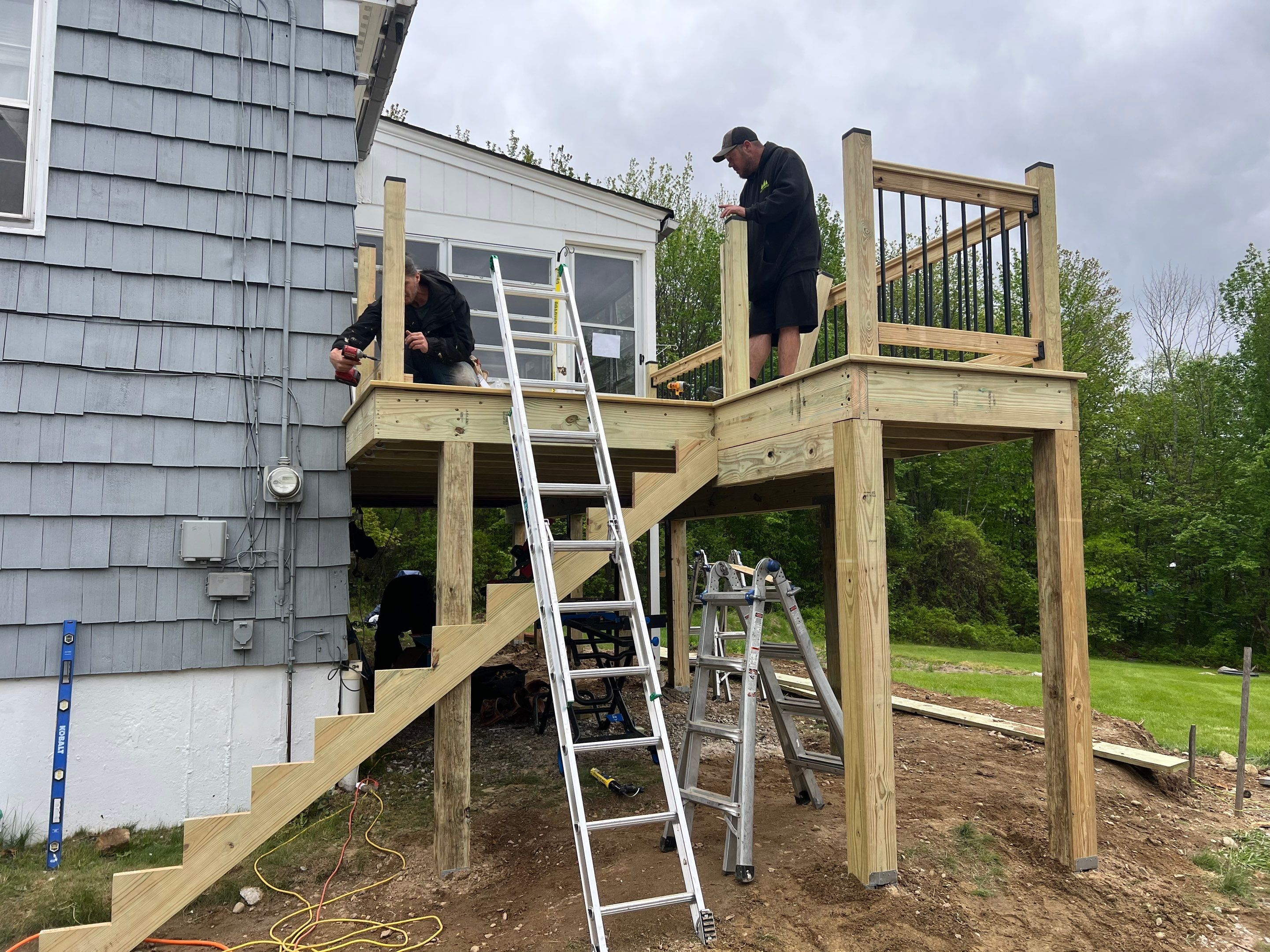Moultonborough, NH – Pressure-Treated Deck Installation by Tall pine roofing