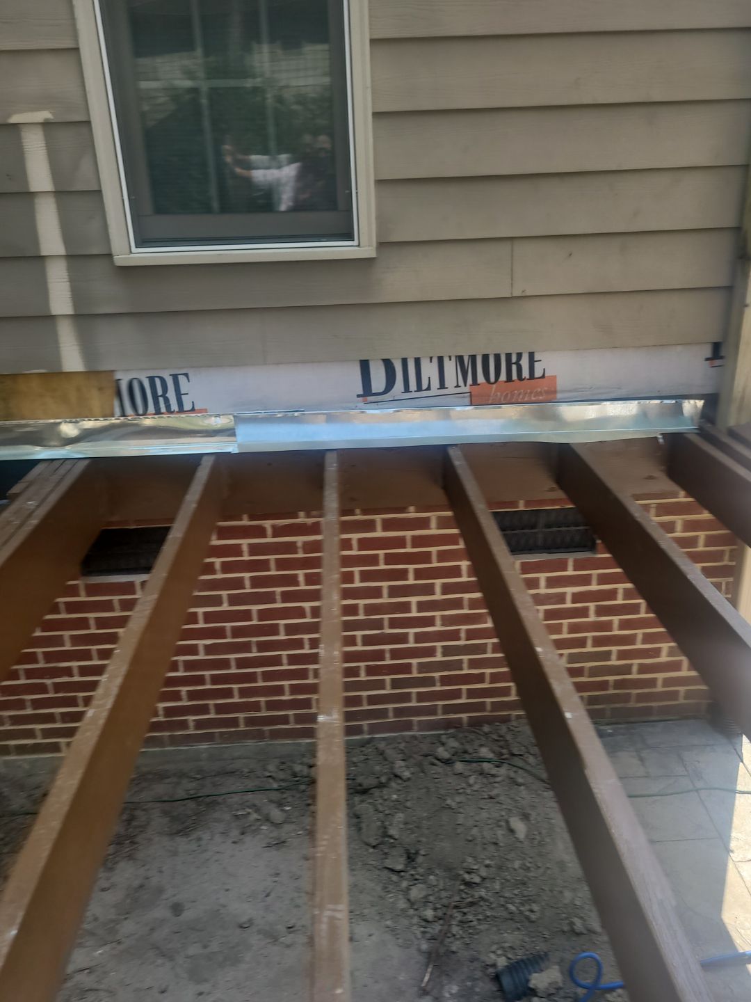 Fuquay-Varina Outdoor Upgrade – Composite Deck & Paved Landing by Elite Remodeling and Design LLC