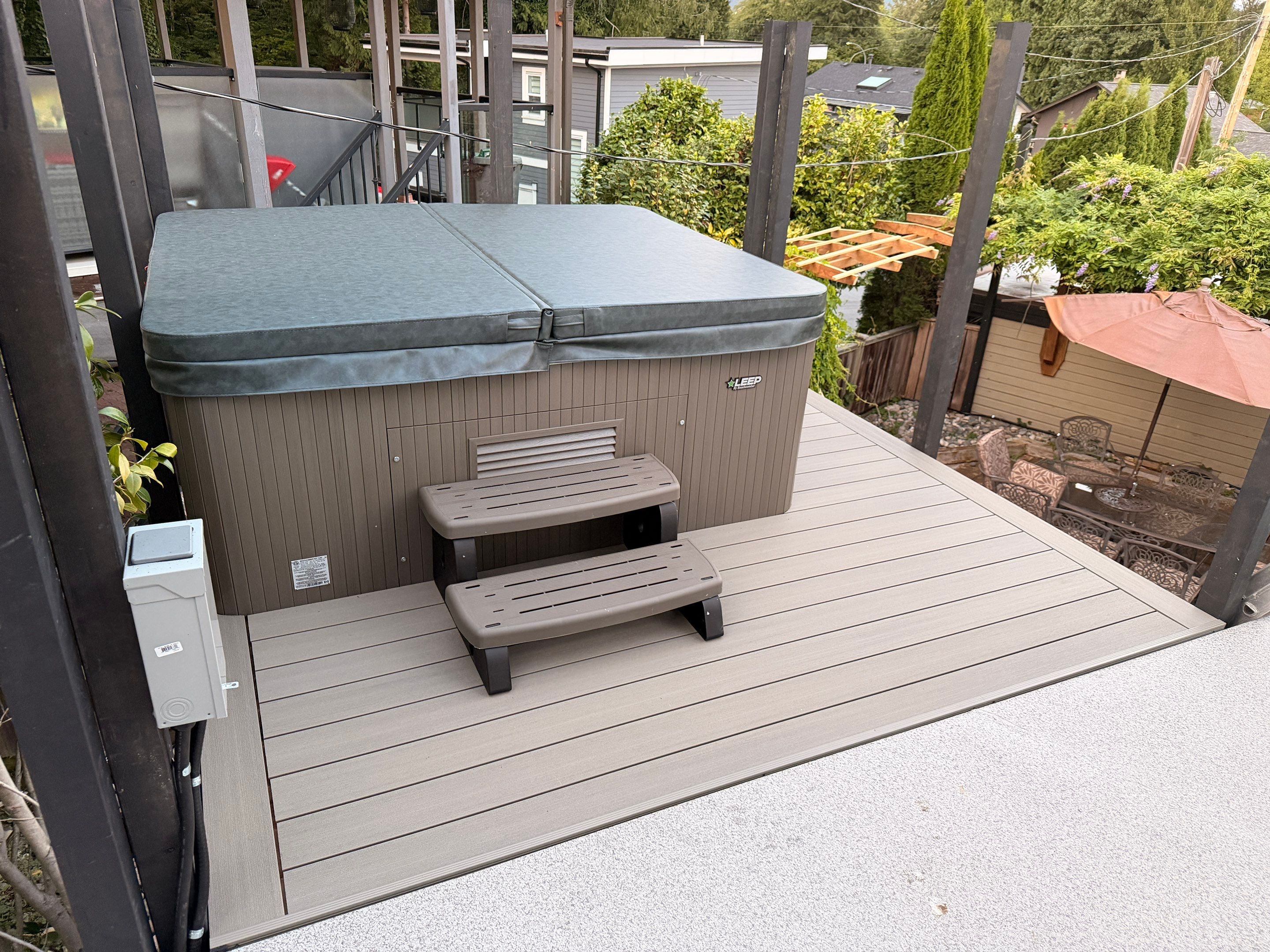 New Composite Deck with glass railing in North Vancouver by YVR Construction Group
