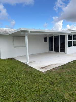 White Aluminum Insulated Roof Installation in Leisureville