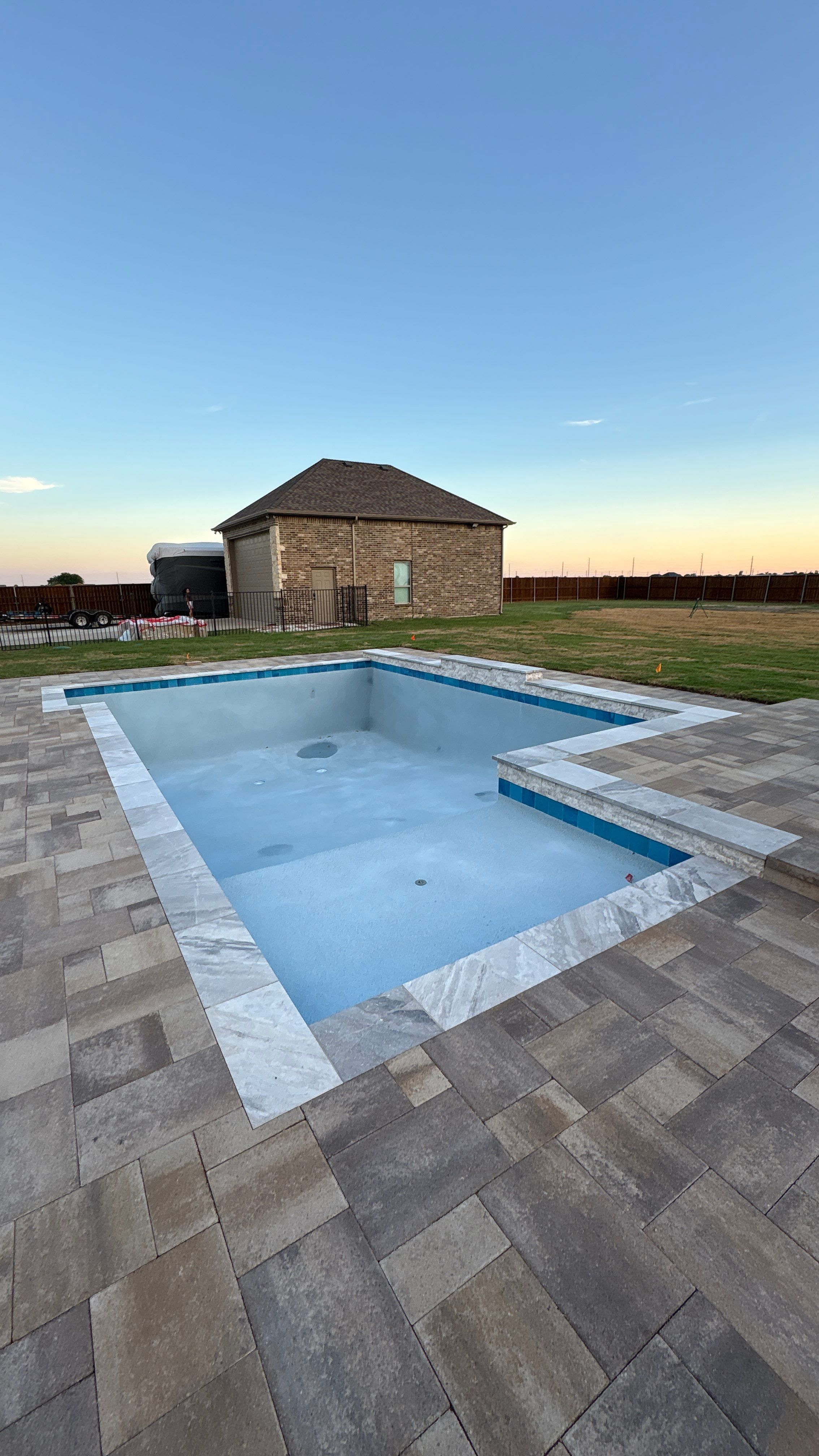Modern Geometric Pool with Tanning Ledge by Pinnacle Pools and Spas - DFW