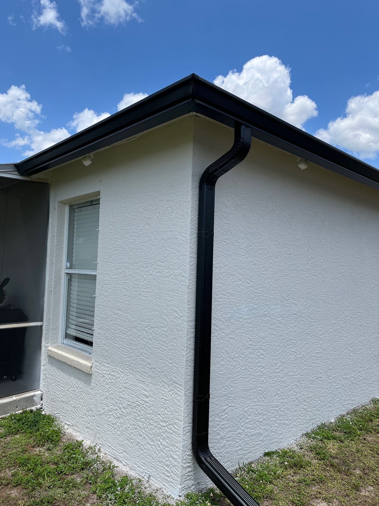 Black Seamless Gutters and Downspouts in Fort Myers FL by Gutter Professors