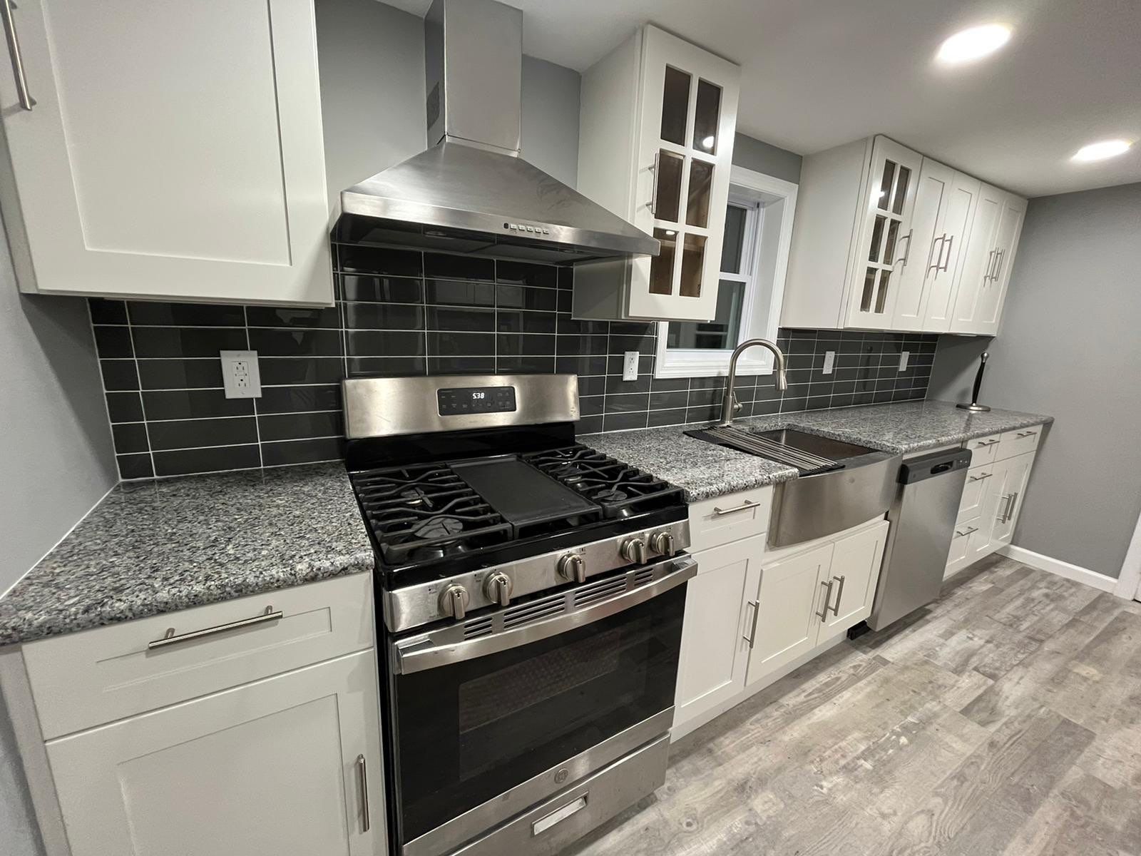 Kitchen Remodel using White Shaker by Home Concepts Construction