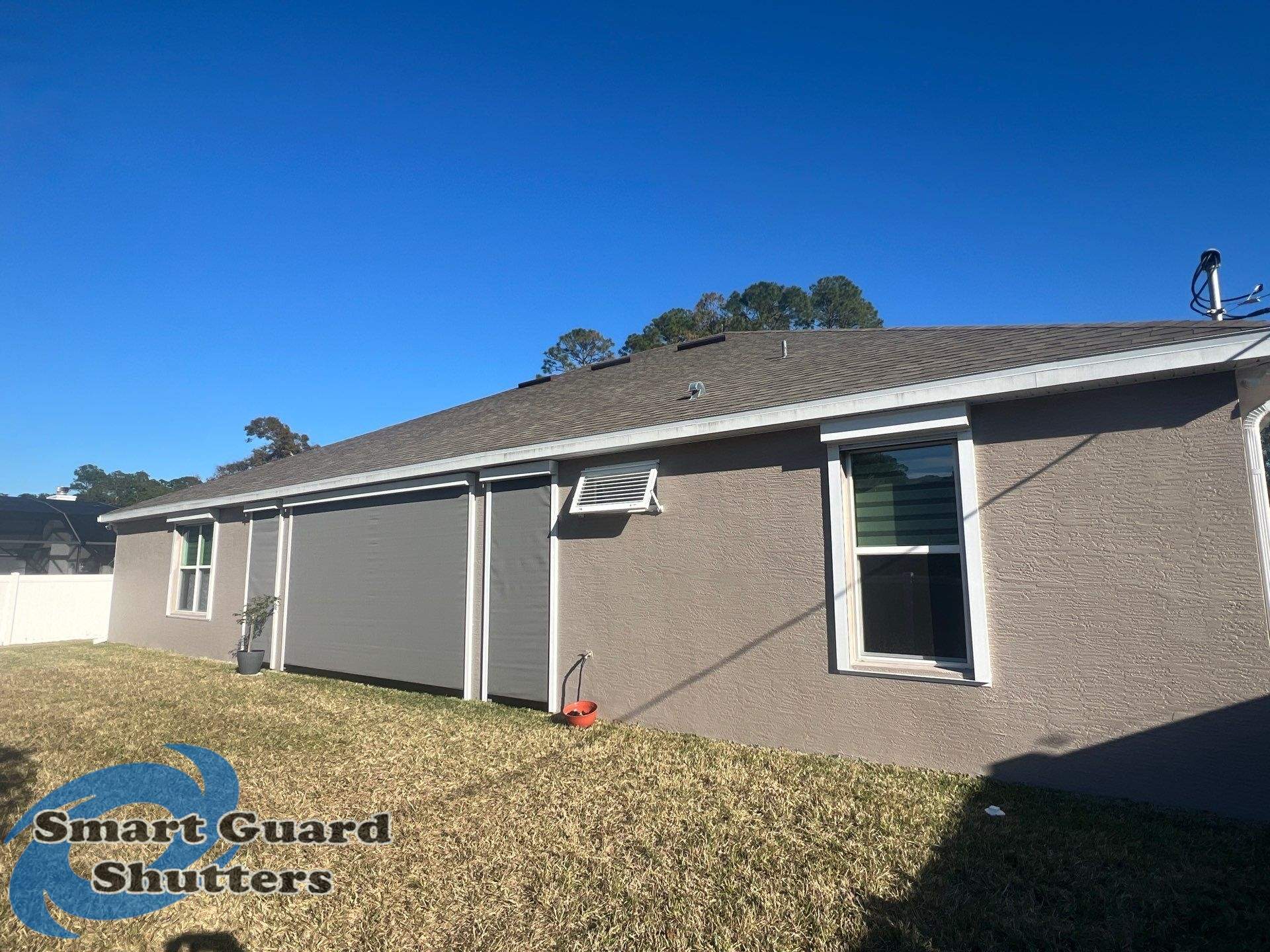 UltraShield Hurricane Screen, Bahamas Shutters in Signal White, Rolling Shutters in White by Smart Guard Shutters