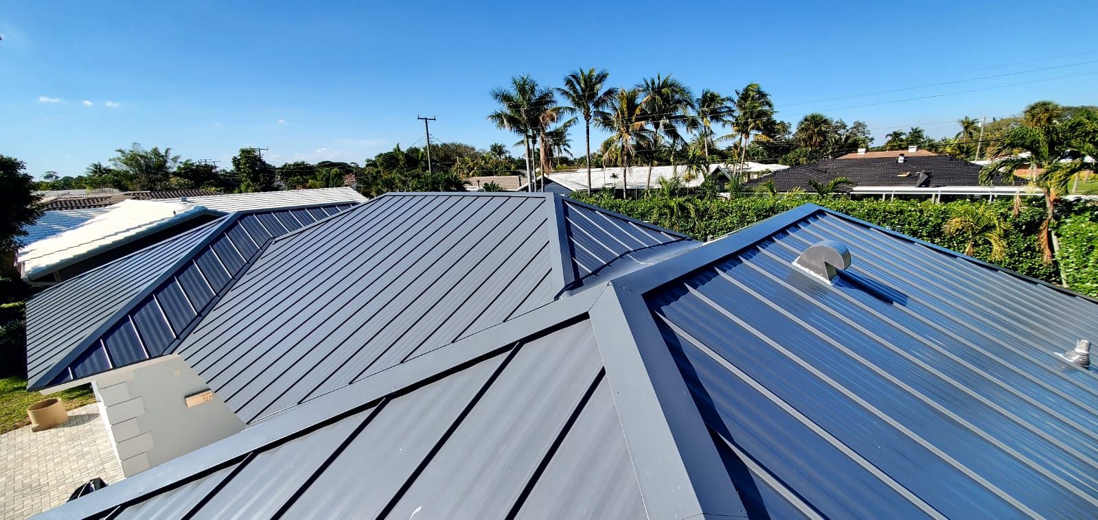 Residential Roofing Installation using 1" Nail strip metal roof by BLUES BROTHERS CONSTRUCTION CORP