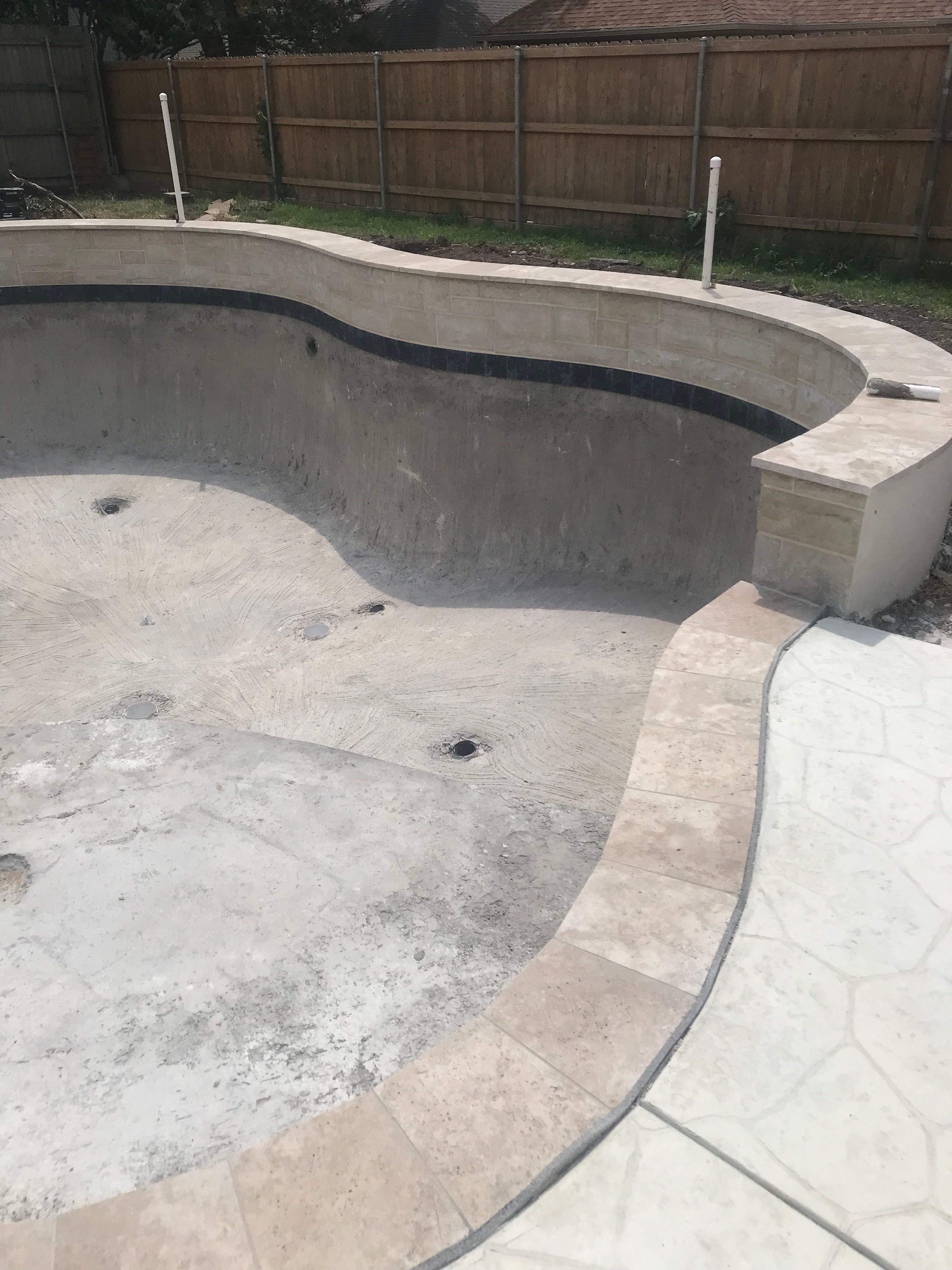 Freeform Pool with Raised Spa and Stone Decking by Pinnacle Pools and Spas - DFW