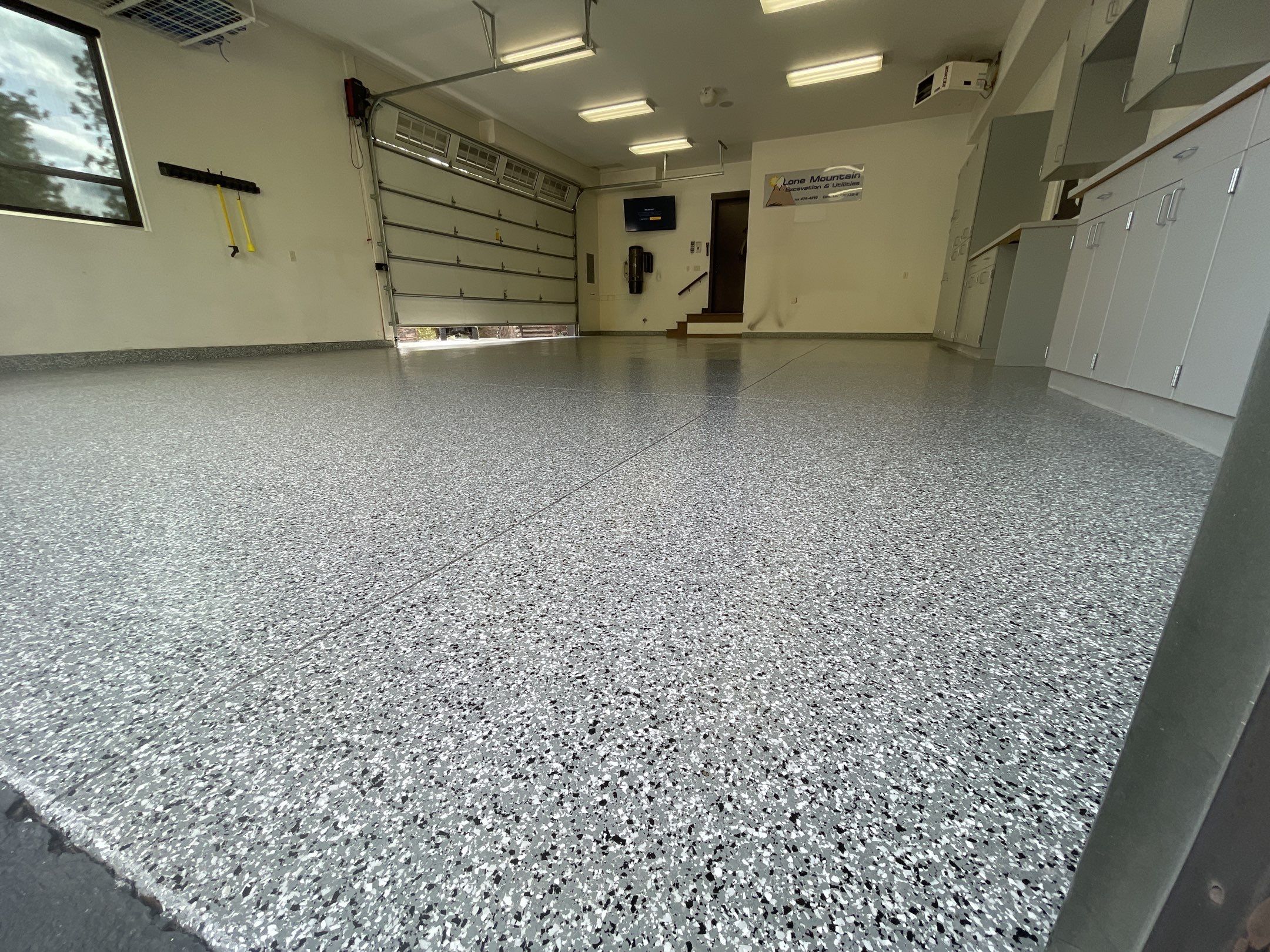 Garage Transformation using Smoke and the Penntek Evolution System by Croc Coatings, LLC