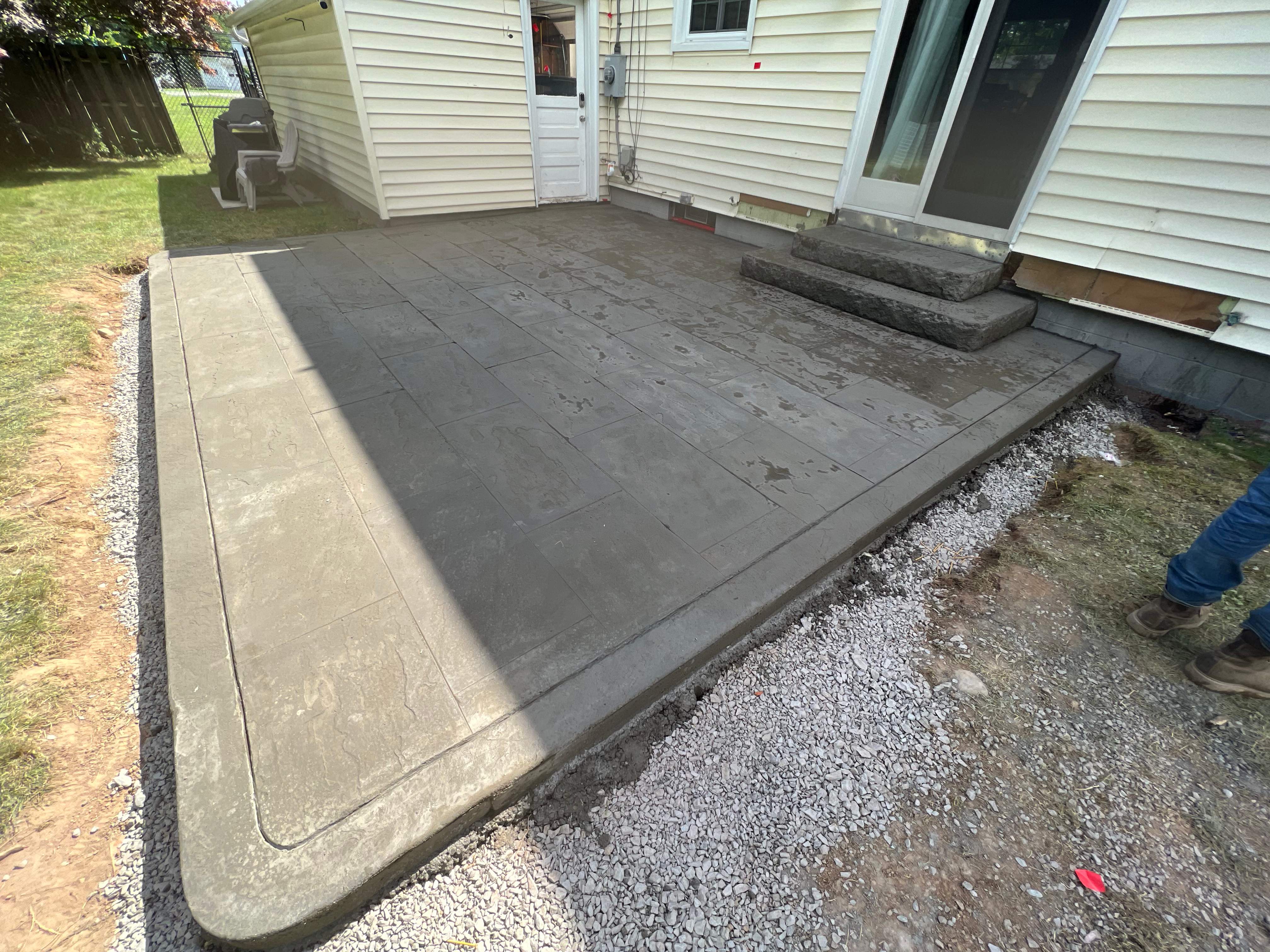 York Bluestone stamped patio  by NG Masonry & Construction LLC