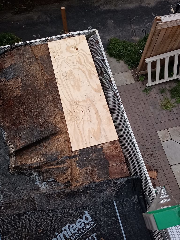 Residential Roofing Installation, Dec-tek walk-out porch roof, siding on garage by Absolute Roofing and Construction