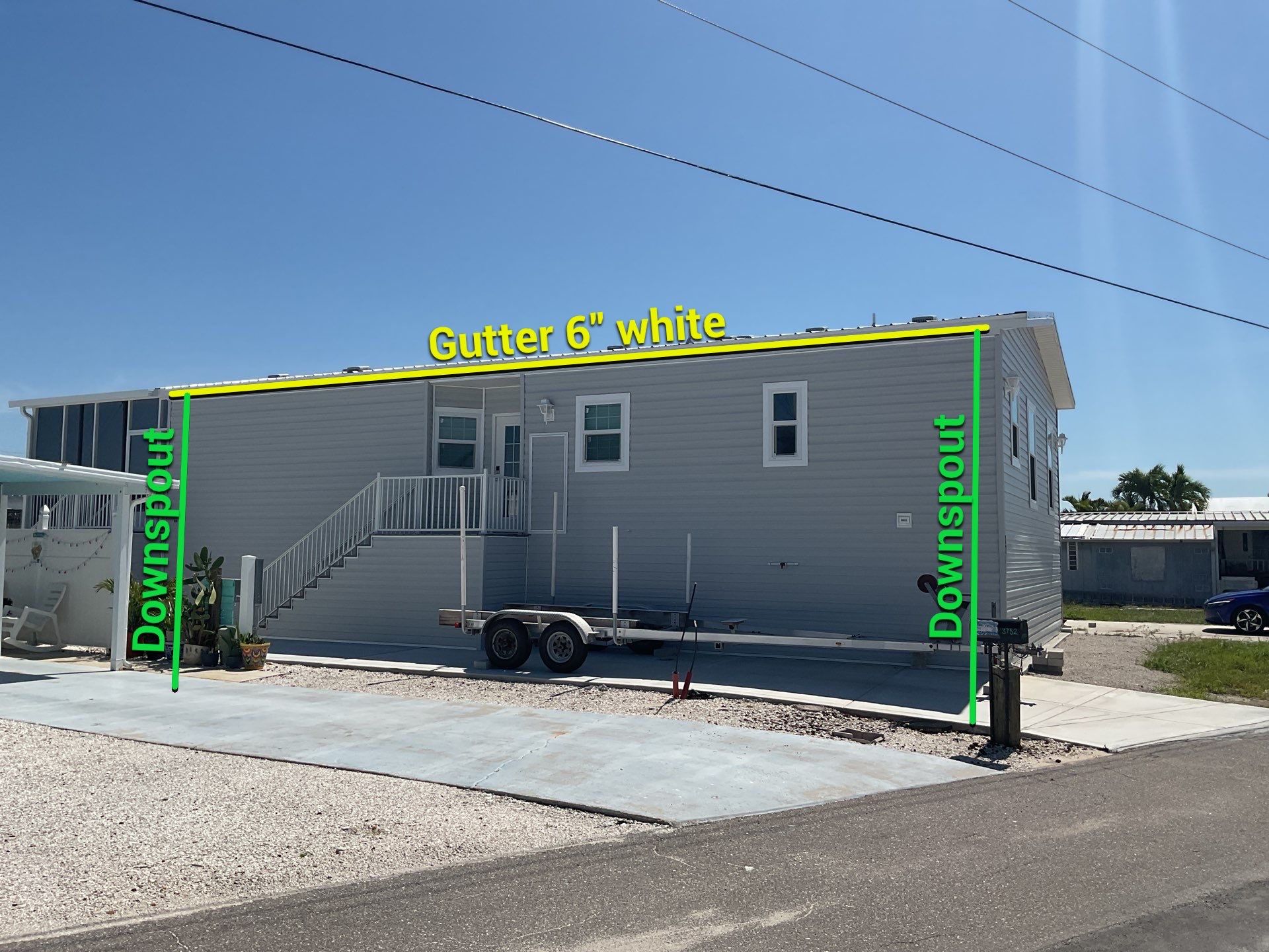 White Downspouts Installation in St. James City by Gutter Professors