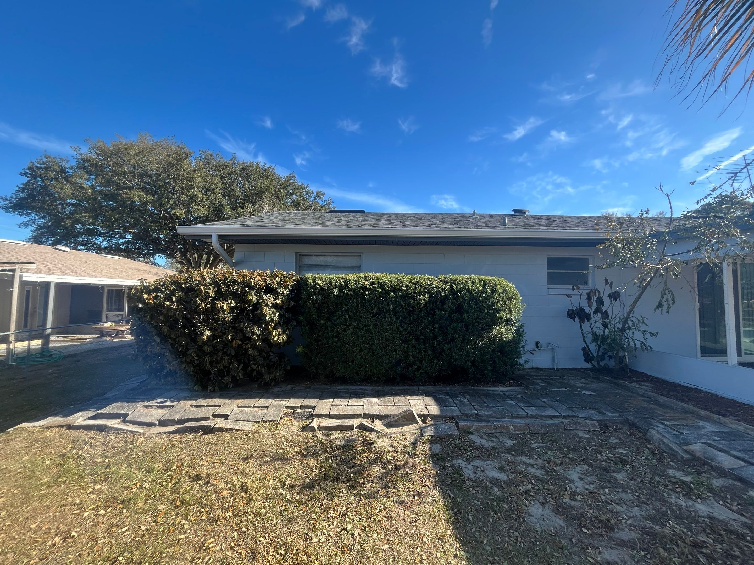 Downspout Installation using Downspout Extension and new Gutters in Winter Haven FL by Gutter Professors