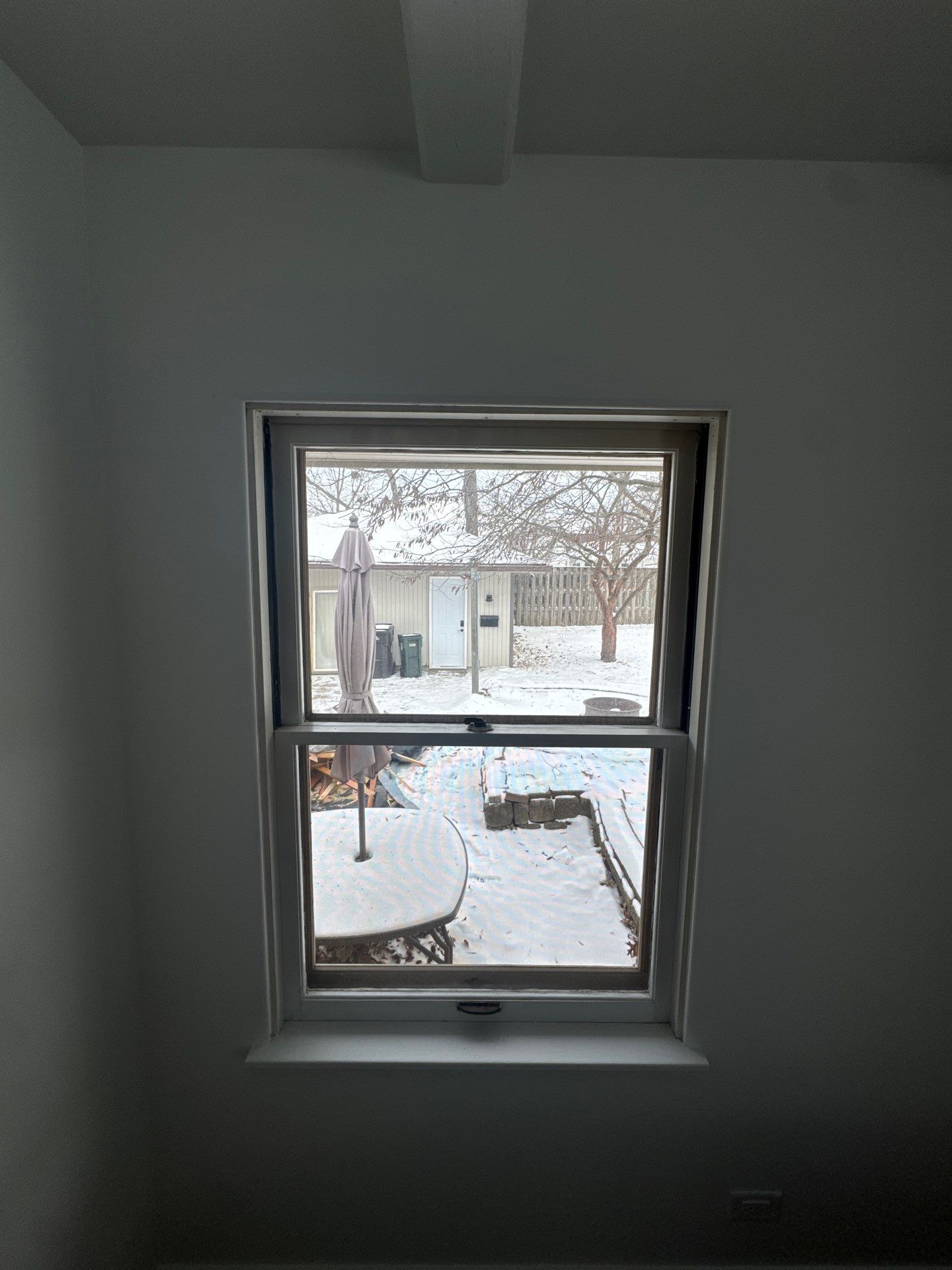 Black-Frame Pella Lifestyle Upgrade on a Partial Brick Home by United Windows and Siding LLC