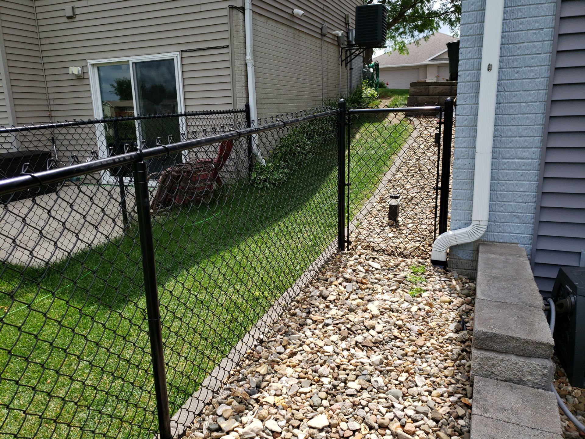 Black Vinyl Chain Link Perimeter Fence Installation in Waterloo by Perfect Picket Fence and Stain