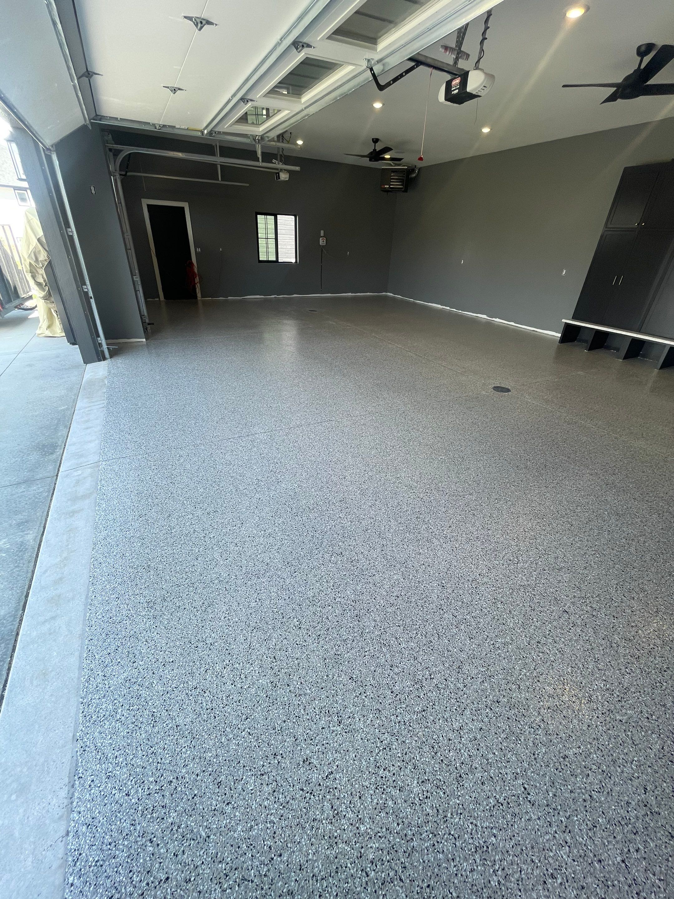 Custom Speckled Concrete Coating for Dell Rapids Garage by Select Painting, Coatings & Garage Cabinets