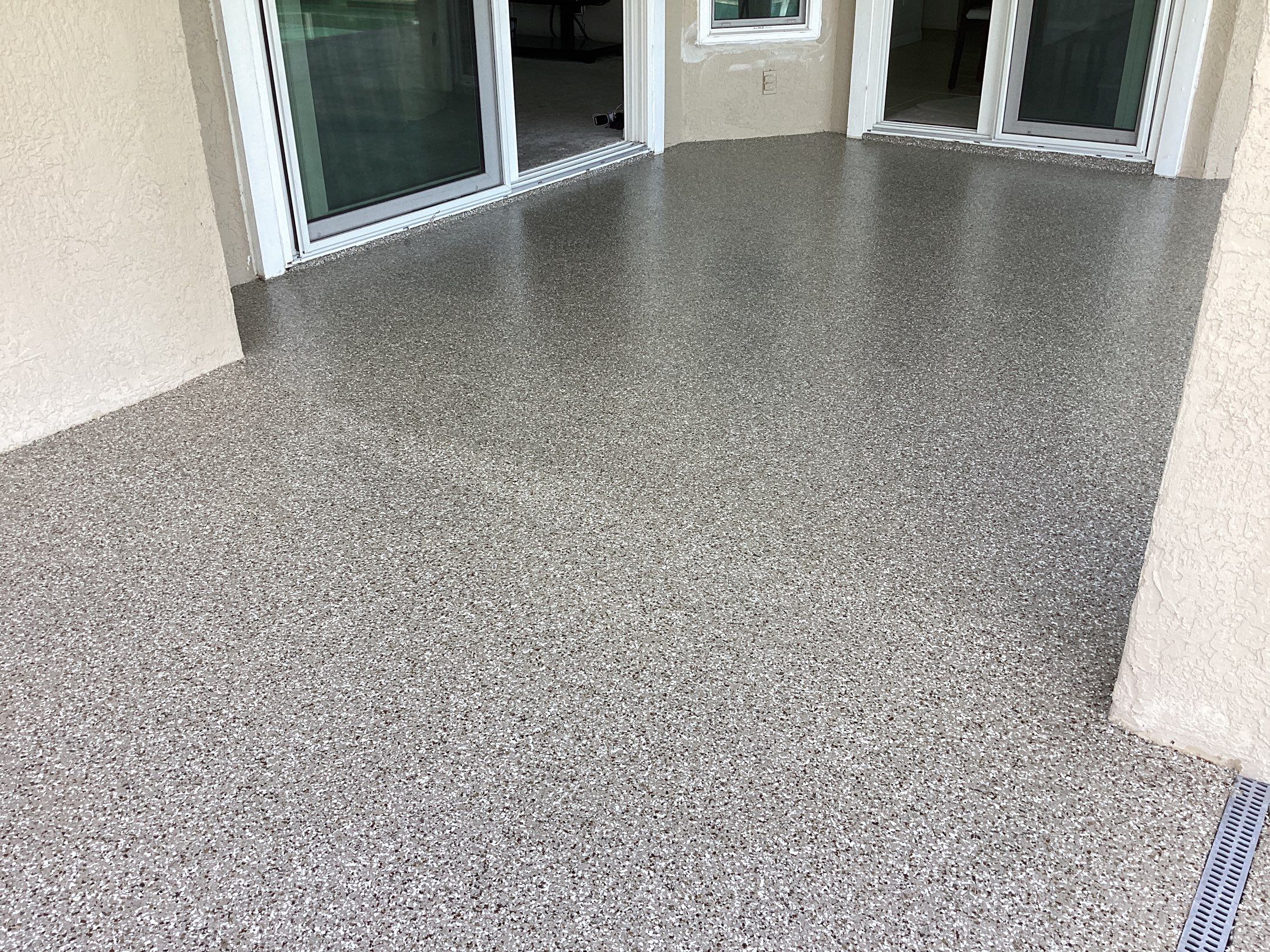 Patio using Pebble Beach by Amvet concrete coatings llc