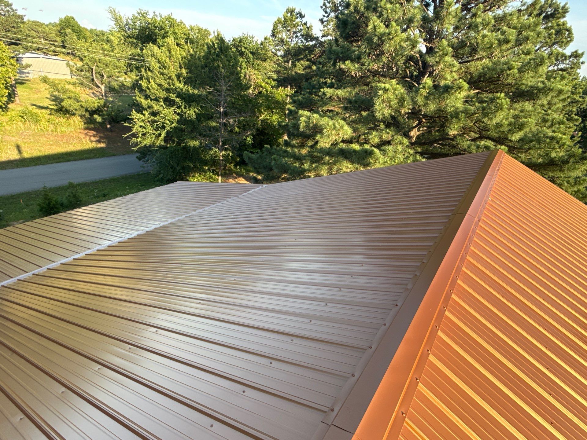 Copper Metallic 26-gauge low rib metal roofing. by In & Out Construction & Remodeling, LLC