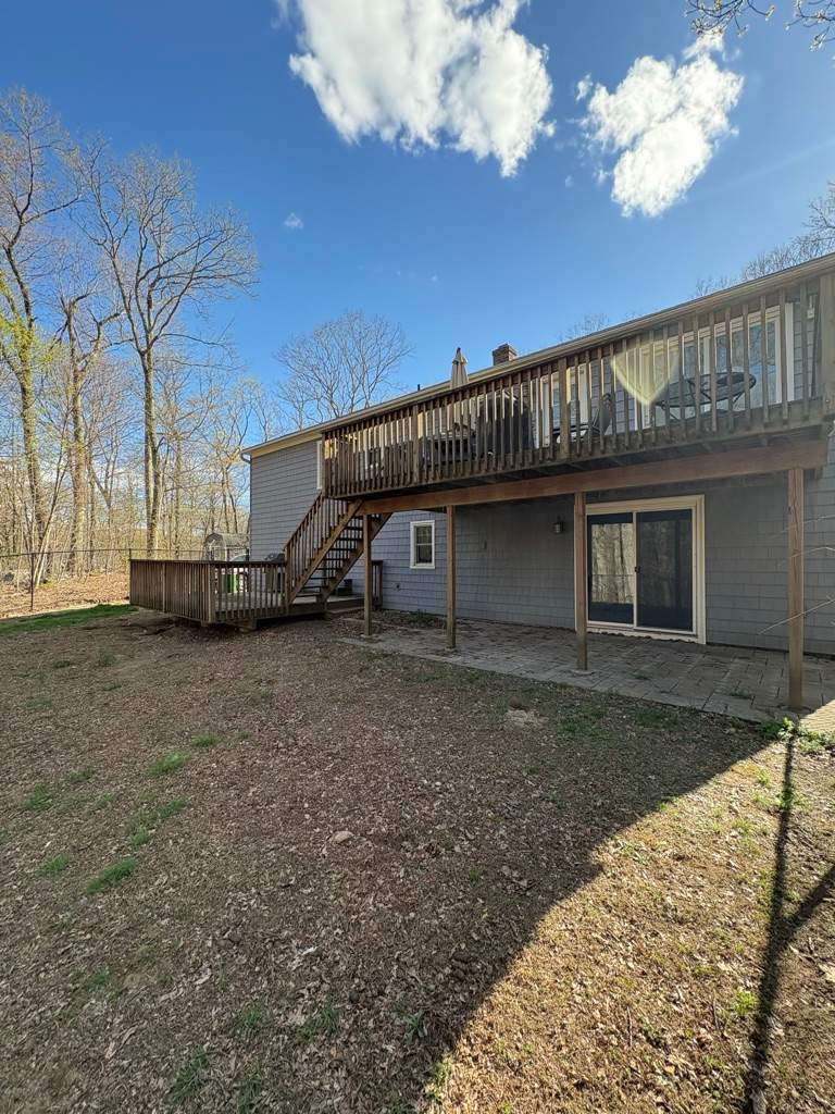 Deck replacement using trex tropical Havana Gold and transcend white railings by DiGiorgi Roofing and Siding Inc