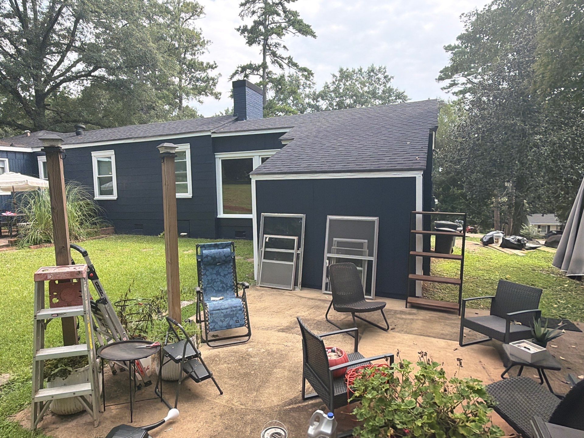 Full Exterior Repaint with Navy Blue and White Trim by Swift Home Renovations
