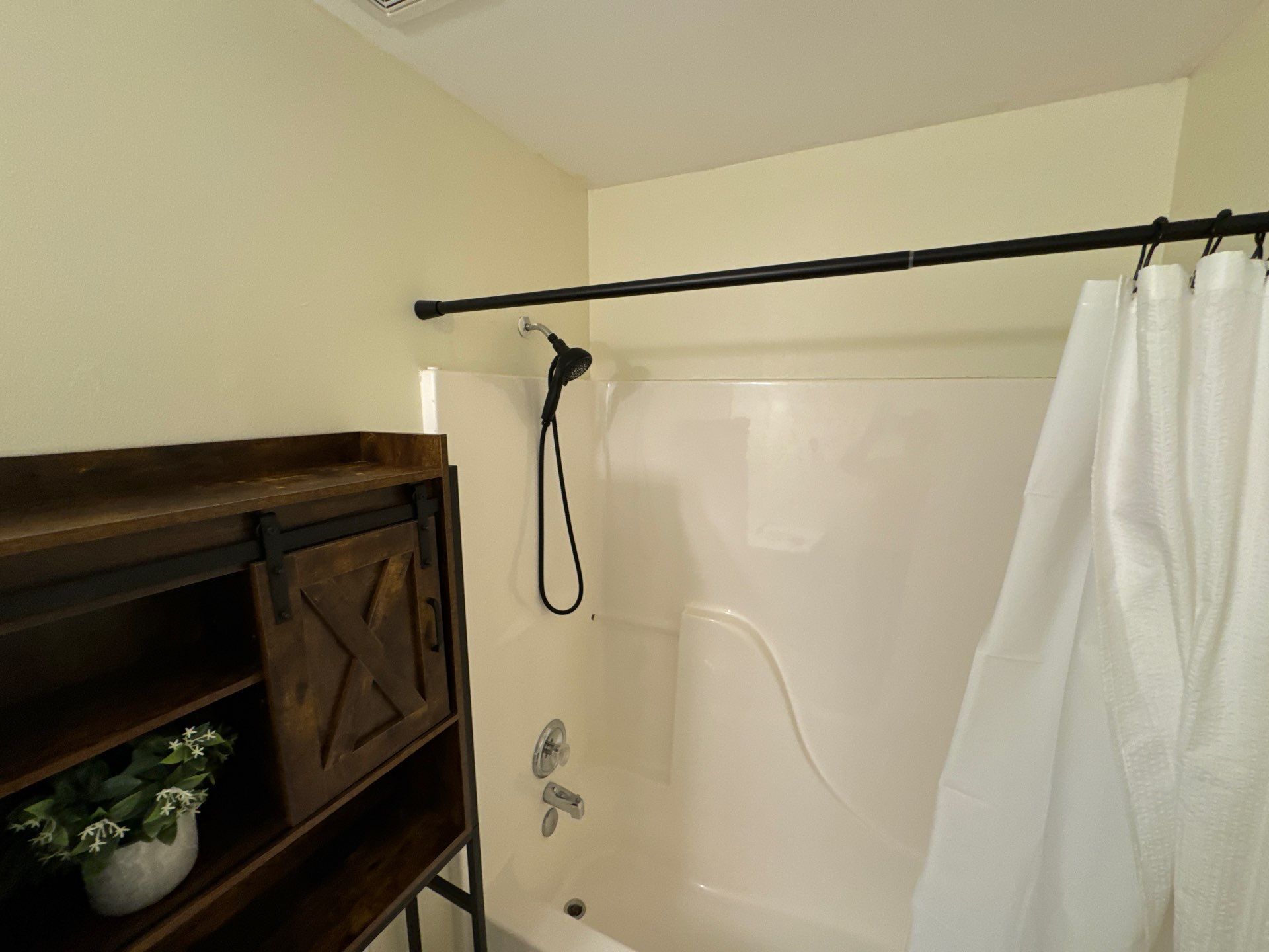 Tub to a curbless walk-in shower by Prudencio